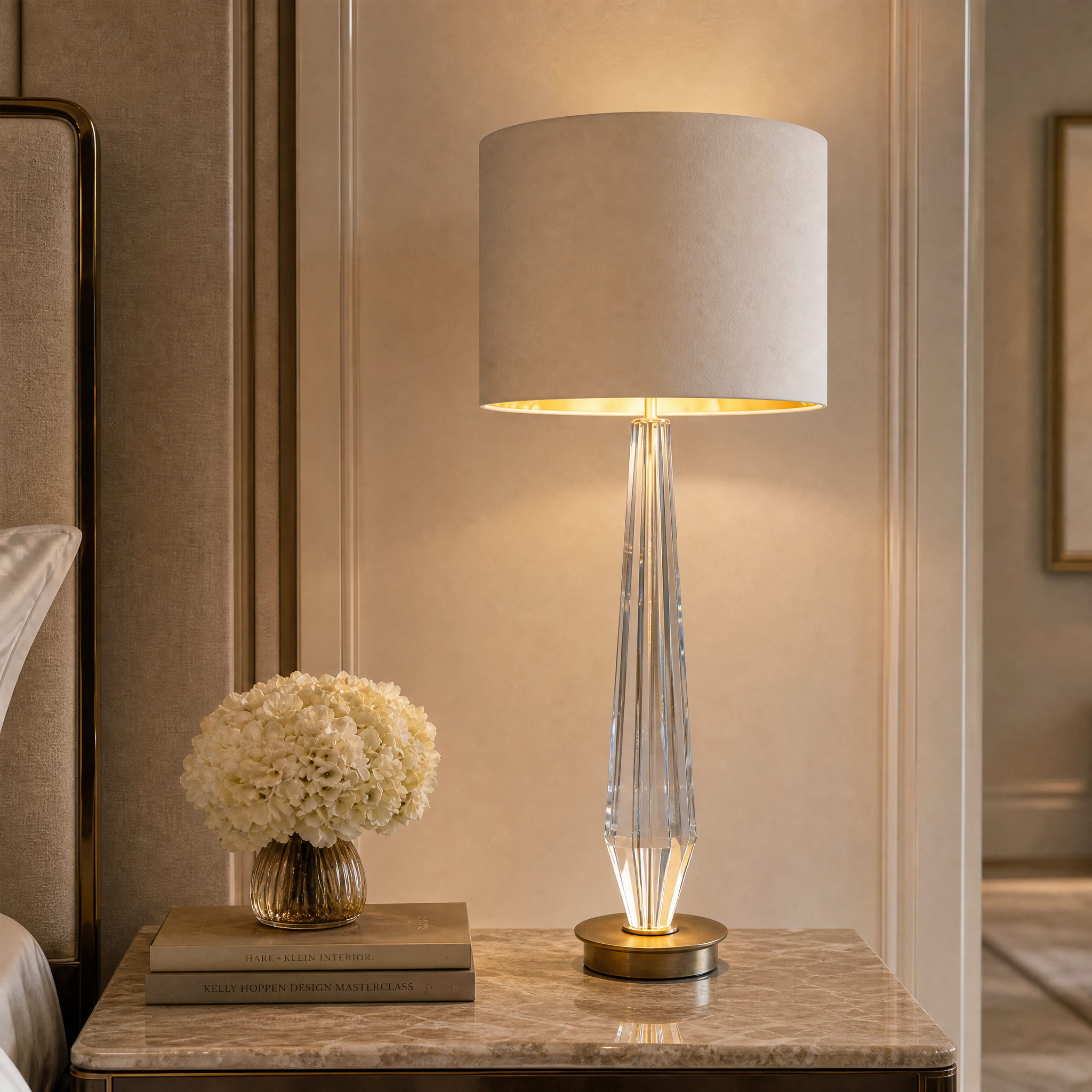 Close up detail of the Valcren Crystal Table Lamp showcasing the antique brass finish and sculpted crystal base.