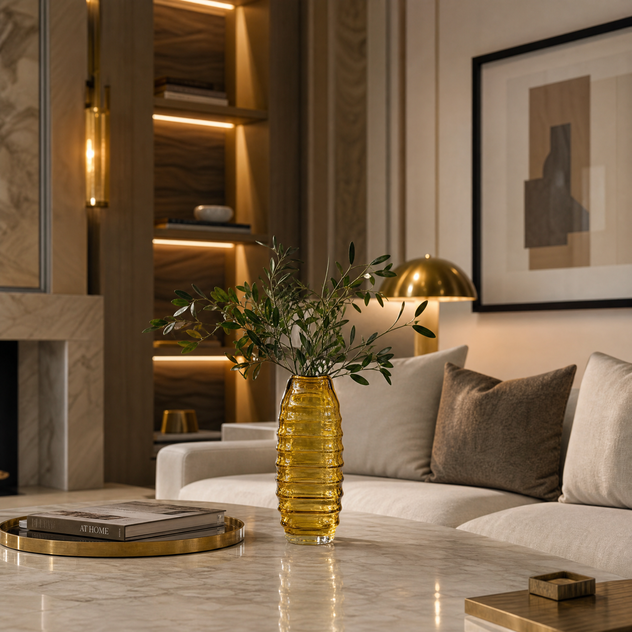 A close-up of the Valdese small yellow glass vase styled on a modern bedside table with natural light.