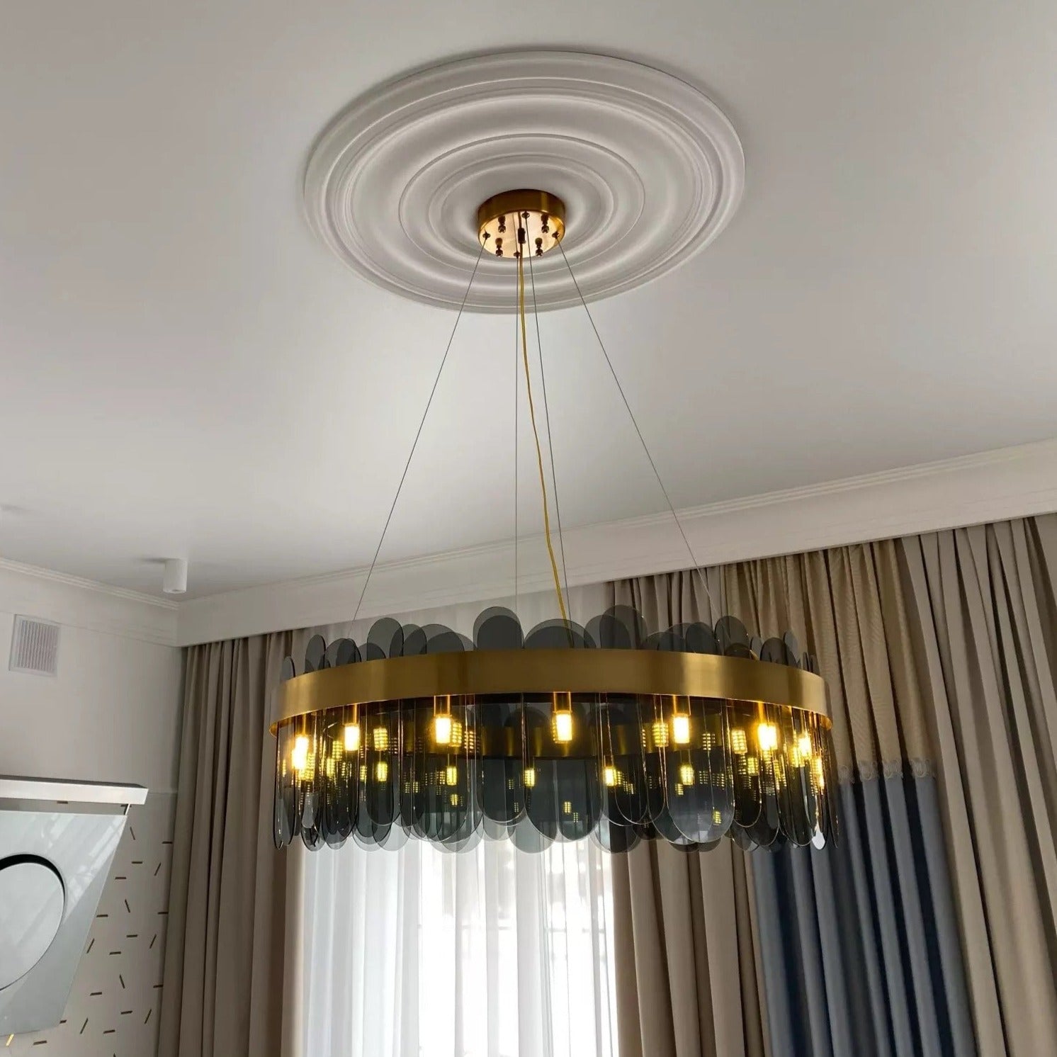 Valparaiso circular chandelier installed in luxury living room interior creating warm ambient illumination