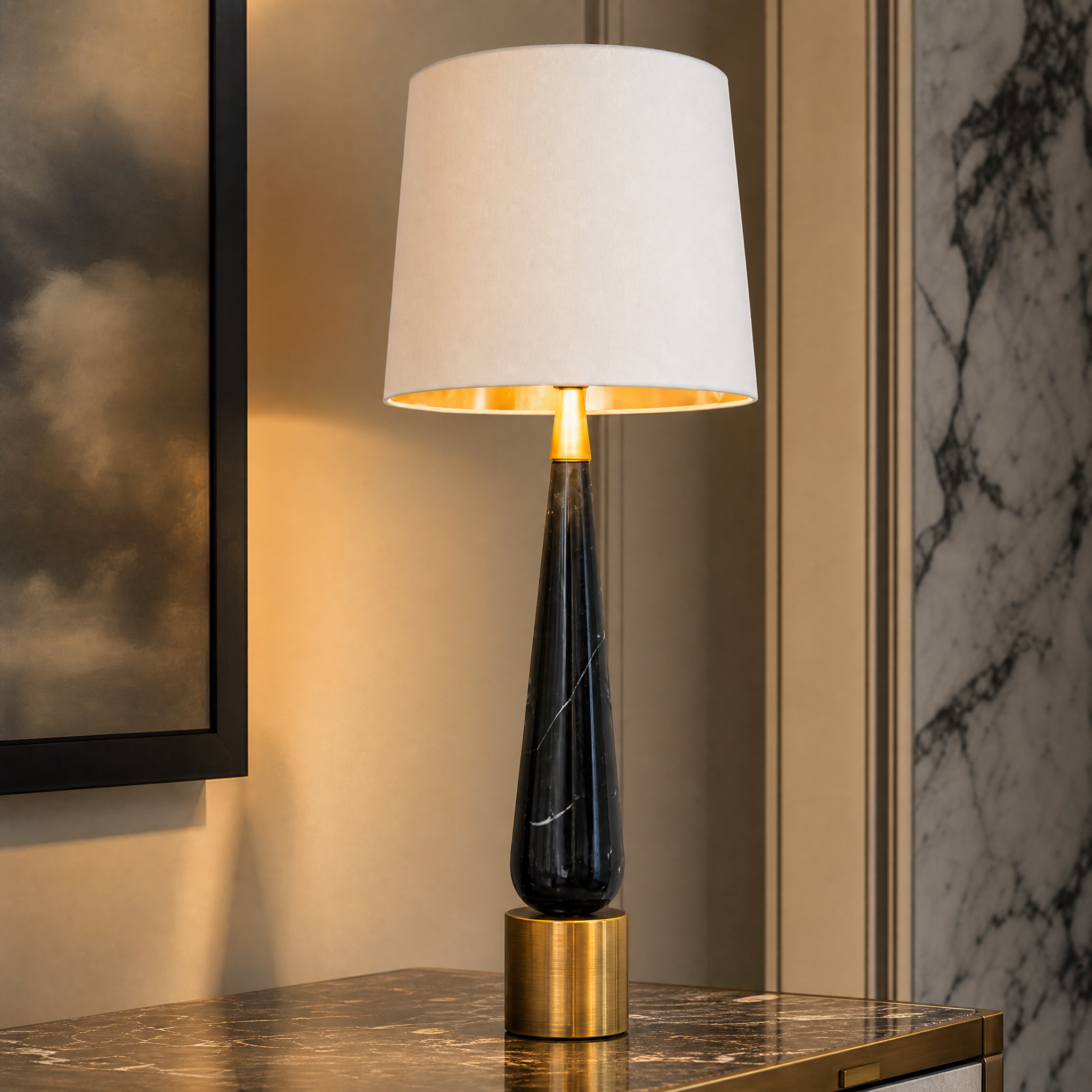 Detailed closeup of the Velcore lamp showing the contrasting textures of the polished black marble body and warm antique brass base.