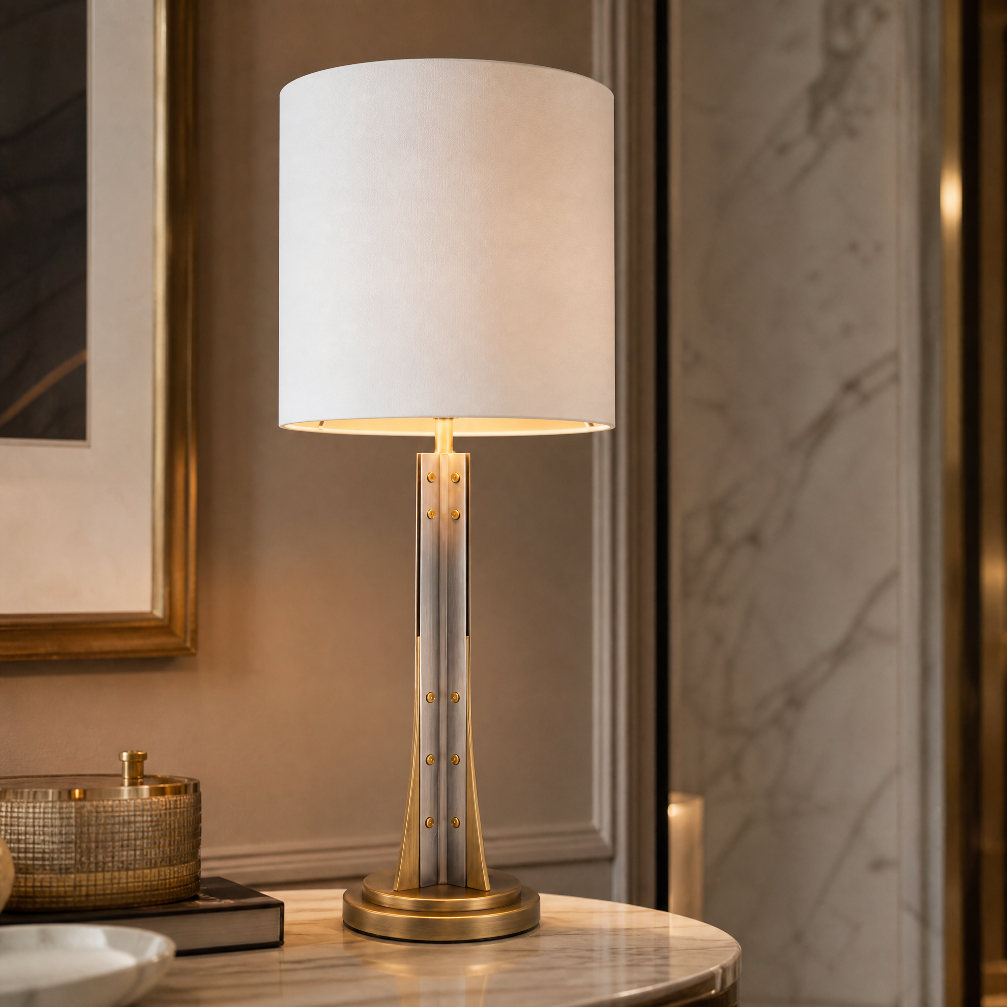 Close up of the Vensaro lamp showcasing the contrast between the antique brass base and sleek gunmetal detailing
