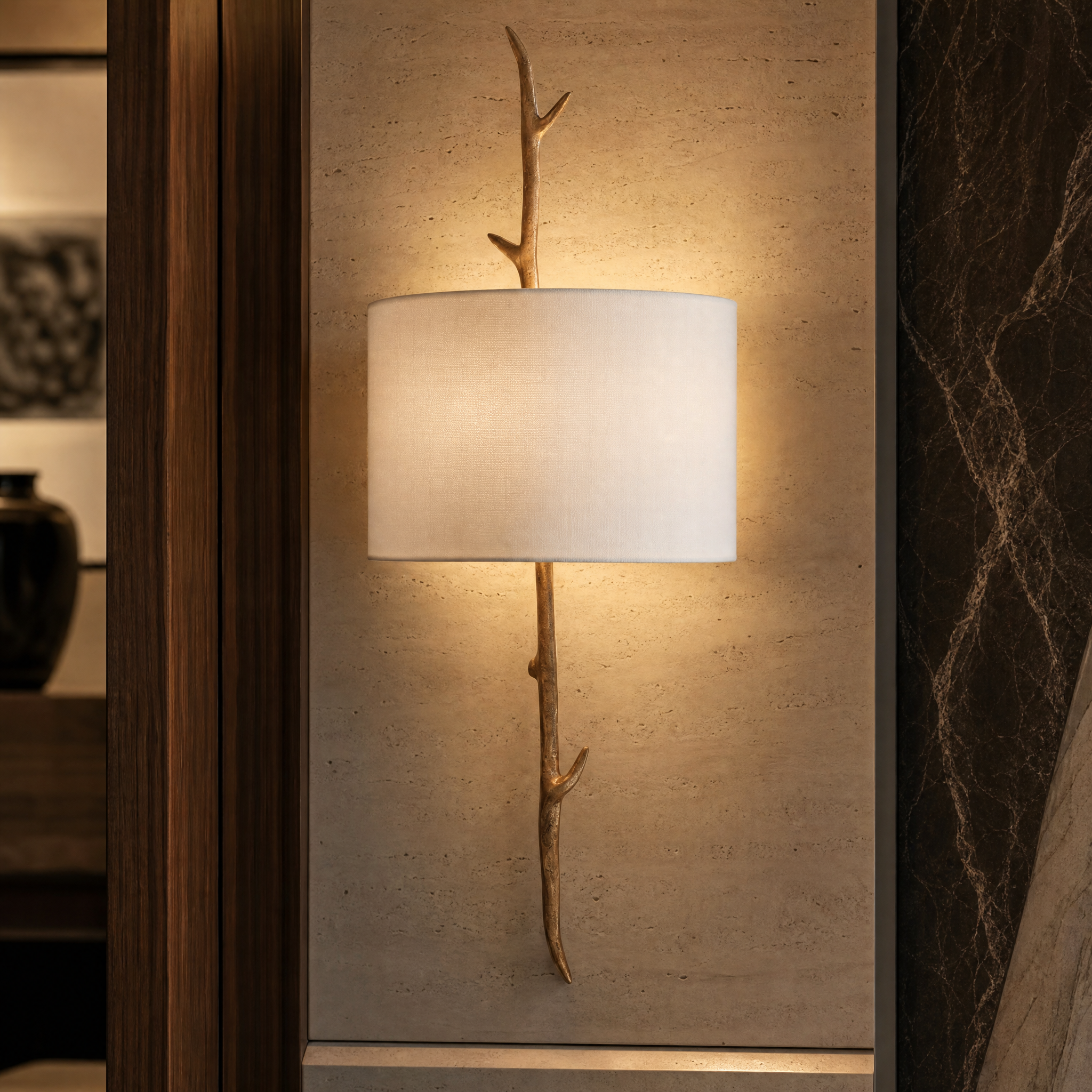 A detailed macro closeup of the Vorelli Verda Wall Light, highlighting the fine texture of the soft fabric shade and the intricate, high-end craftsmanship of the sculptural branch frame.