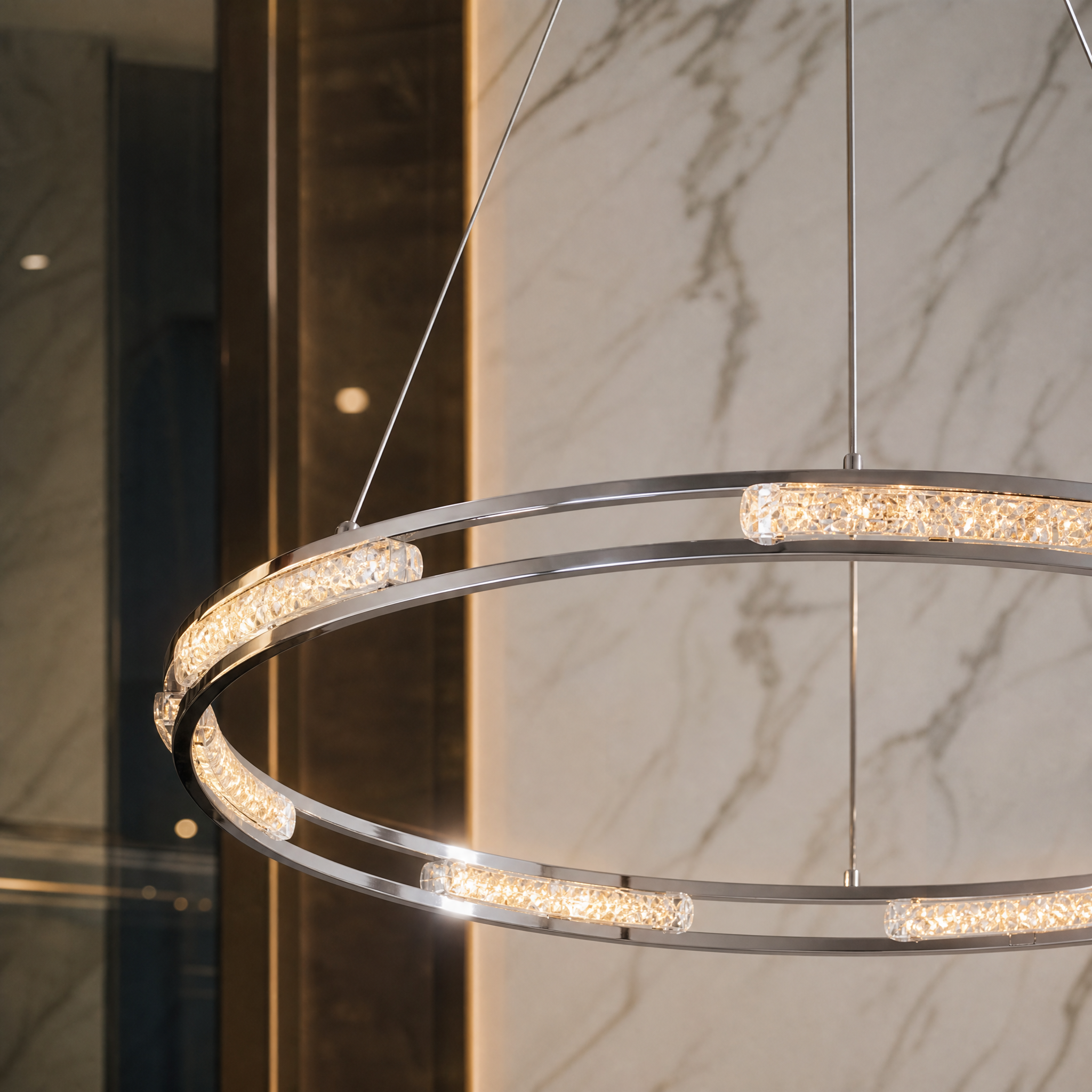 Close-up view of the VORELLI Vermacelli Ring Chandelier showcasing the intricate diamond-cut square crystals and polished stainless steel frame.