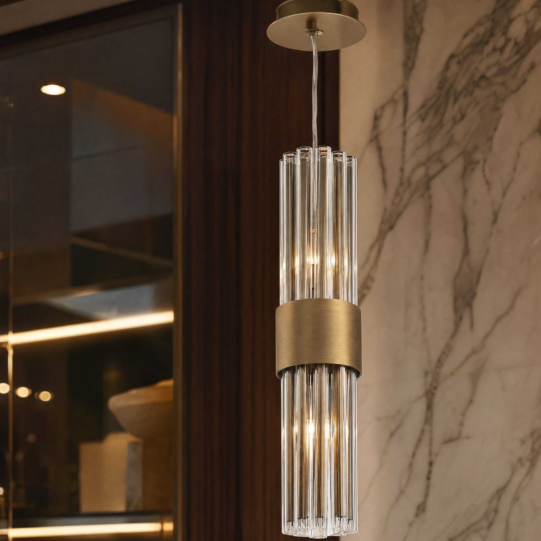 Close-up detail of the vertical crystal tubing and premium antique brass finish on the VORELLI Victoria pendant light.