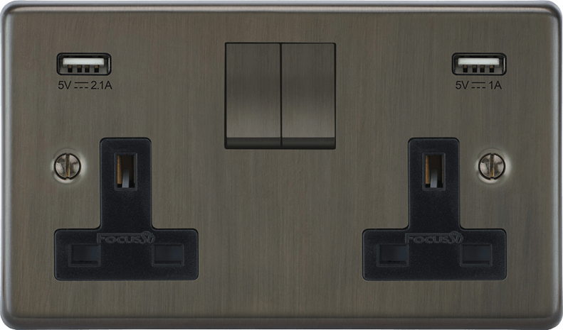 Victorian double socket mounted on dark wood paneling for a traditional look.
