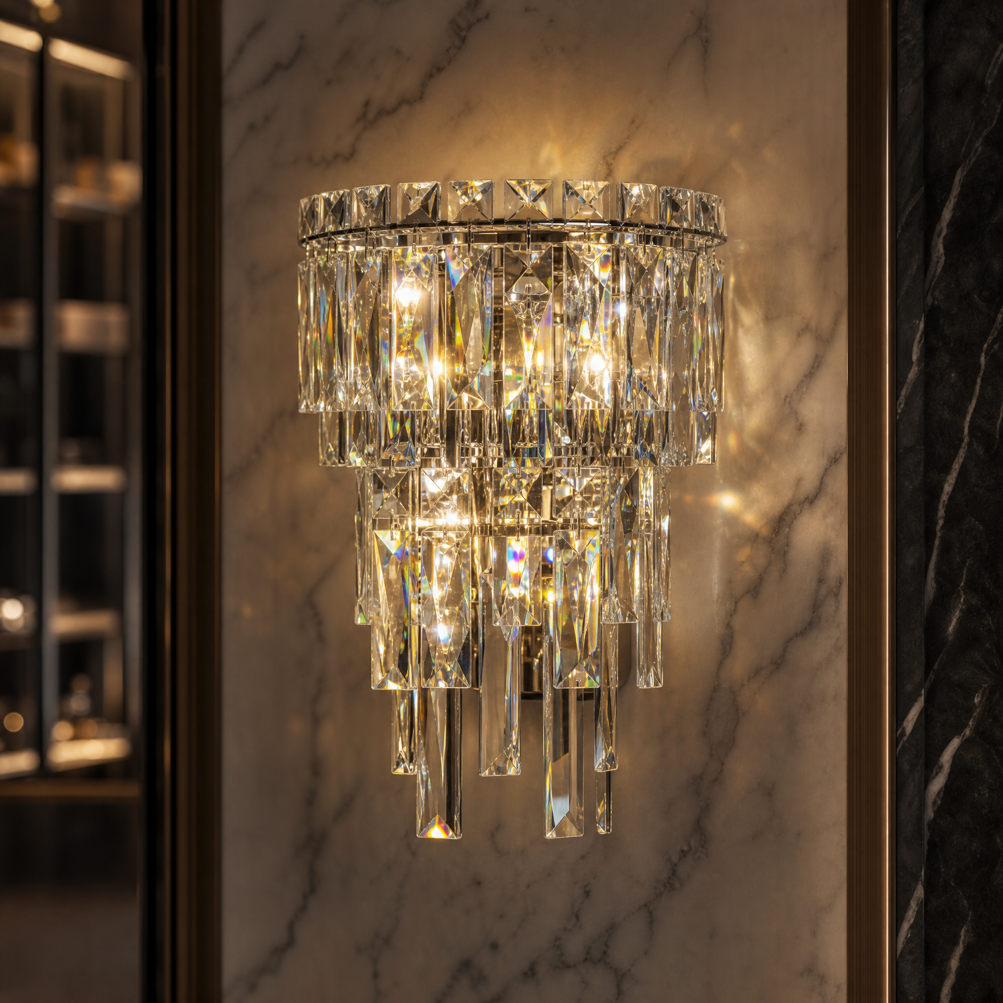 A detailed close-up of the VORELLI Abruzzi wall light, highlighting the precision-cut crystals shimmering with timeless sophistication.
