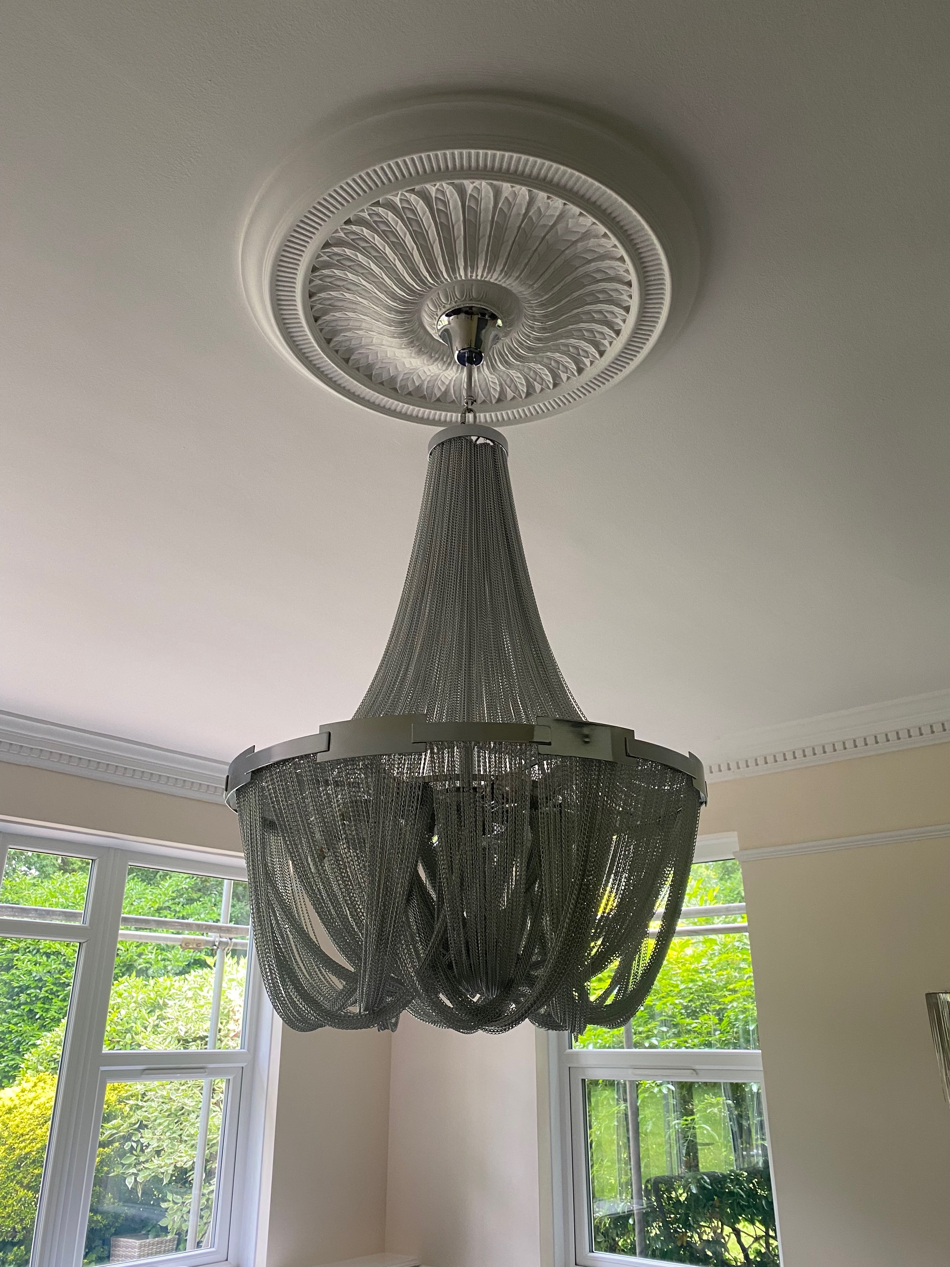 Adlington Grandeur staircase chandelier installed in a double-height stairwell with cascading crystal chains and elegant proportions