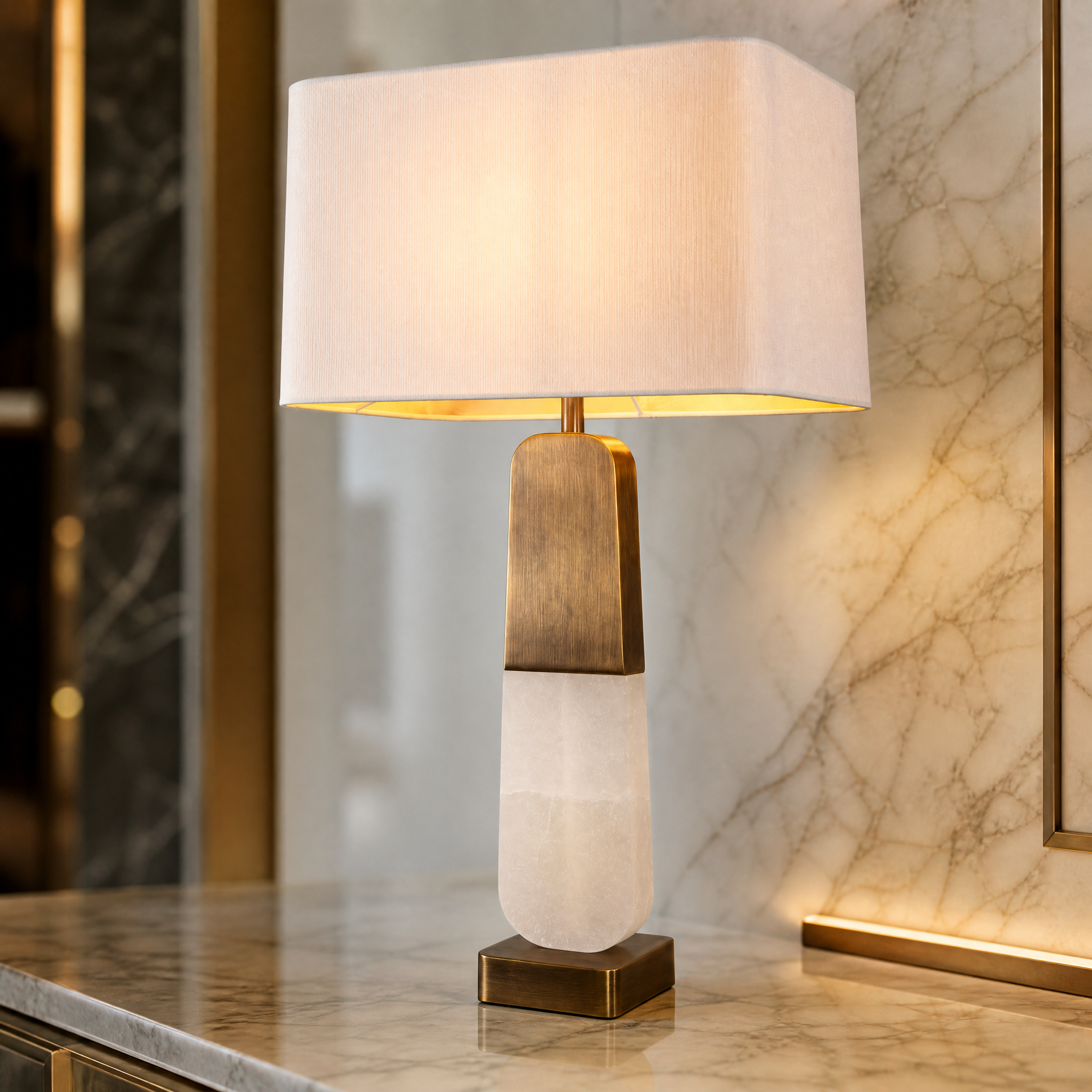 A detailed close-up showing the rich texture of natural alabaster and the refined antique brass accents of the VORELLI Alvani statement table lamp.