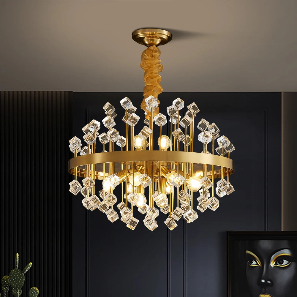 Alytus chandelier shown in a dark-walled room, highlighting clear crystal details and gold ceiling rose.