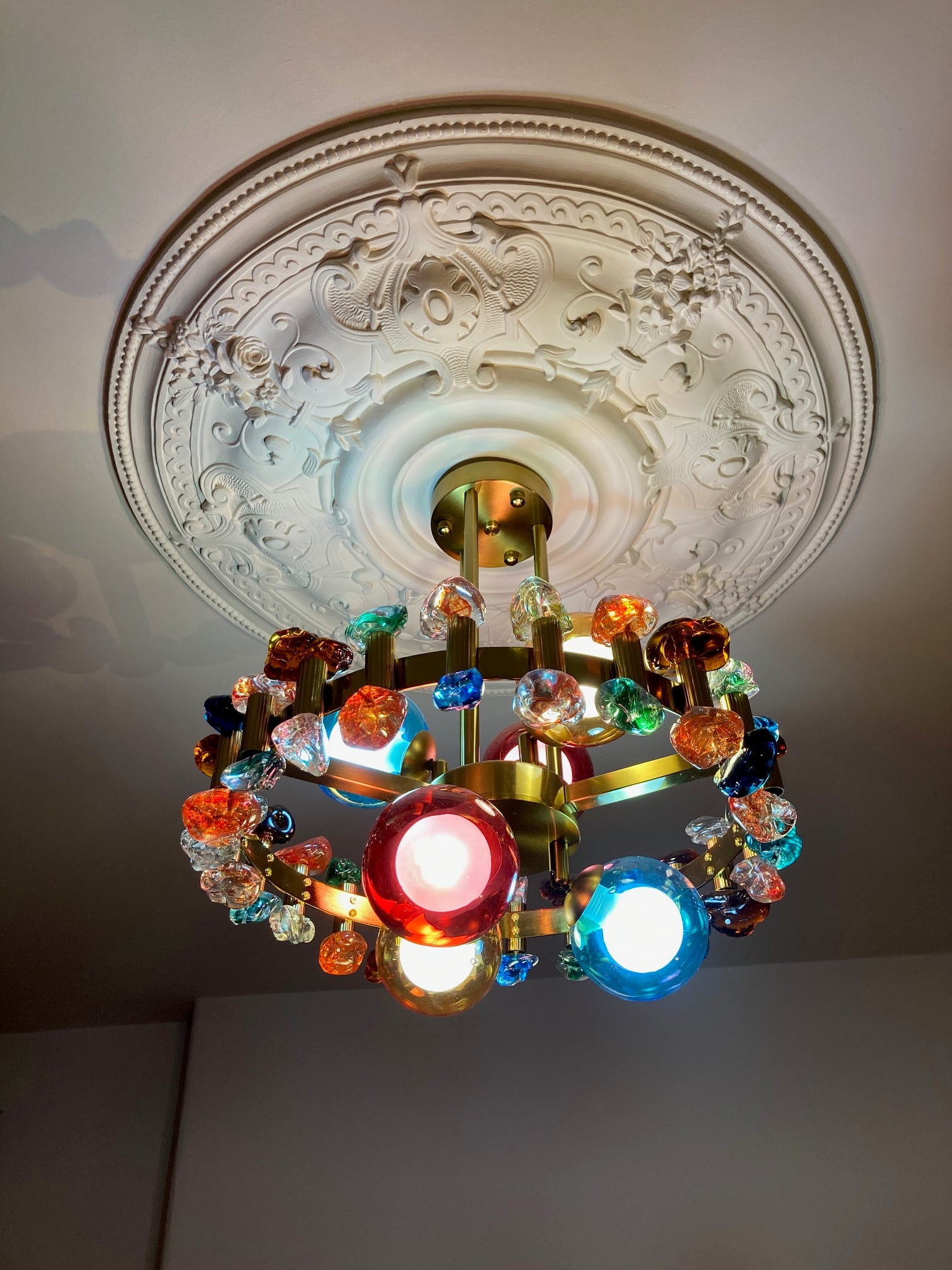 VORELLI Alytus pendant light featuring coloured crystal spheres in a luxury interior ceiling setting