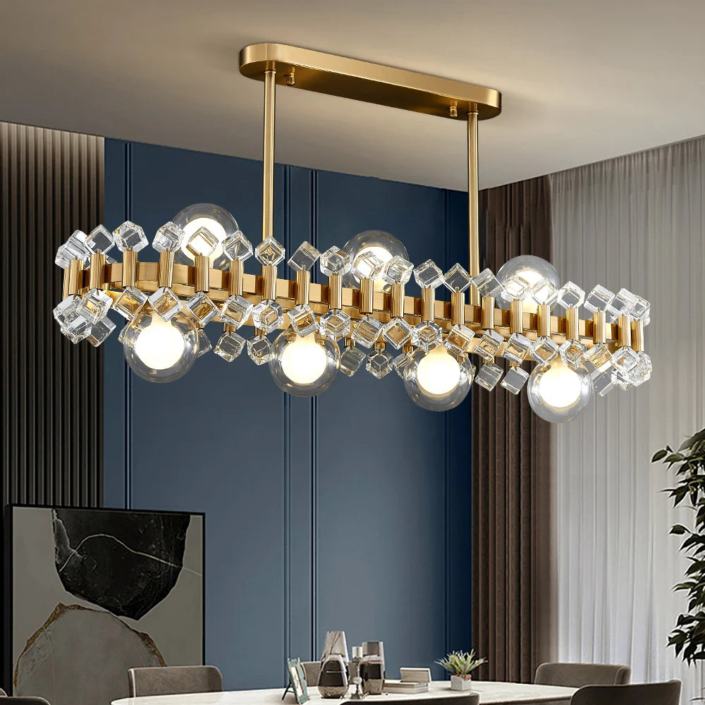 Alytus Rectangular Chandelier II featuring clear cracked crystals on a gold rectangular frame in a contemporary room.