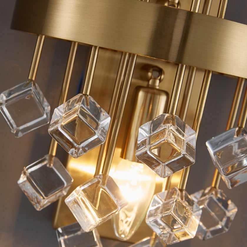 Elegant variation of the Alytus Wall Light with clear glass spheres and polished gold detailing.