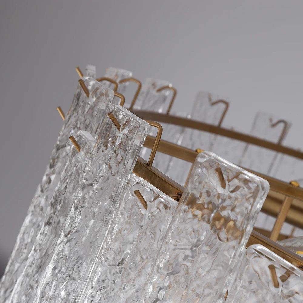 Angled view of the Ambani Circular Chandelier showcasing the staggered arrangement of cracked crystal rods and refined detailing.