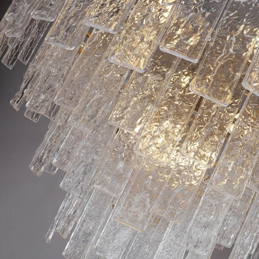 Close-up side angle of the Ambani Rectangular Chandelier showing textured crystal panels and their layered, light-catching structure.