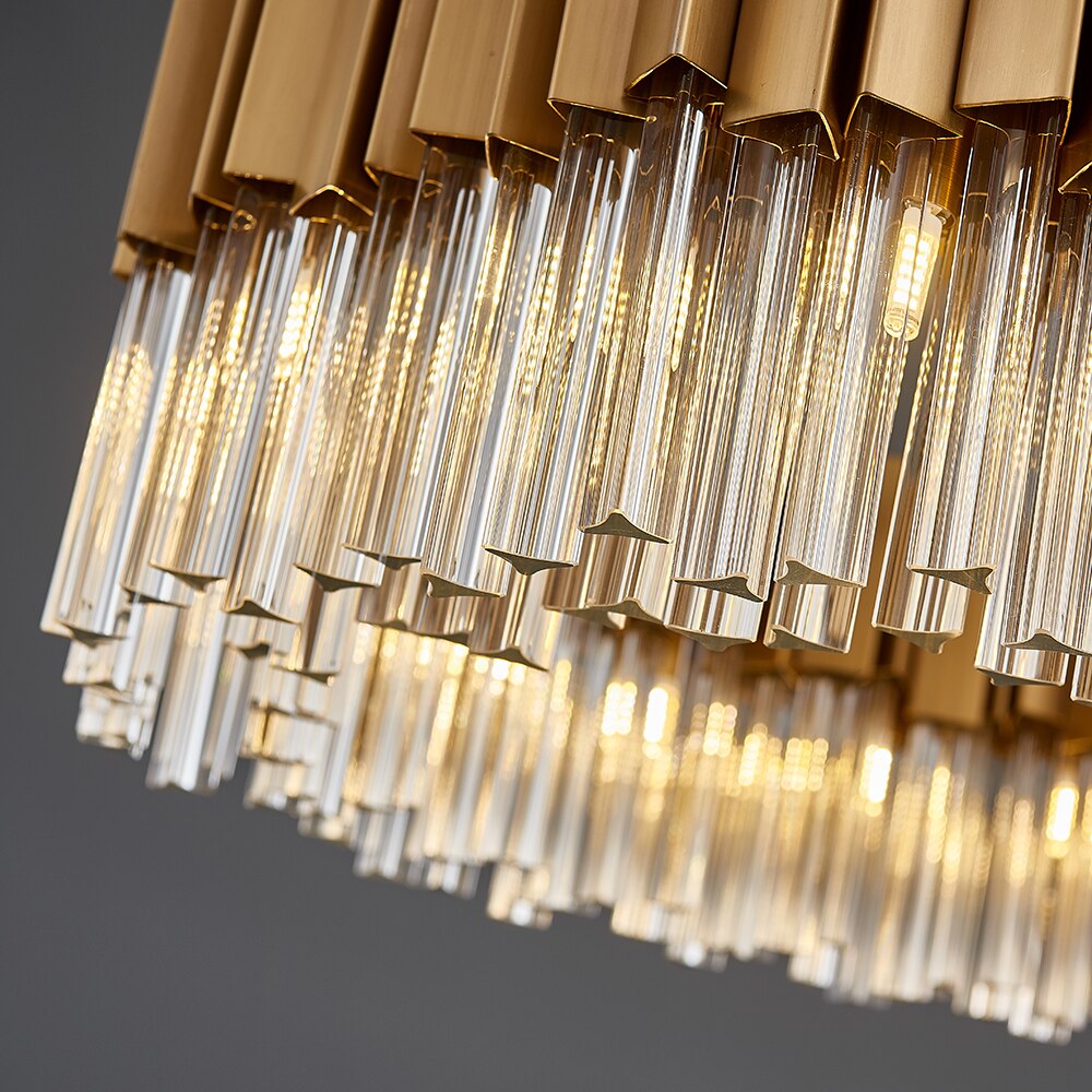Underside view of the rectangular chandelier highlighting the arrangement of prism-cut crystal bars and warm glow.