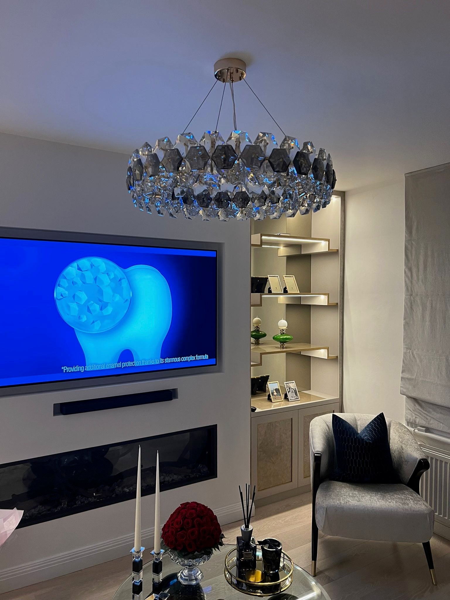 Astoria circular chandelier adding statement lighting to a luxury kitchen and dining space