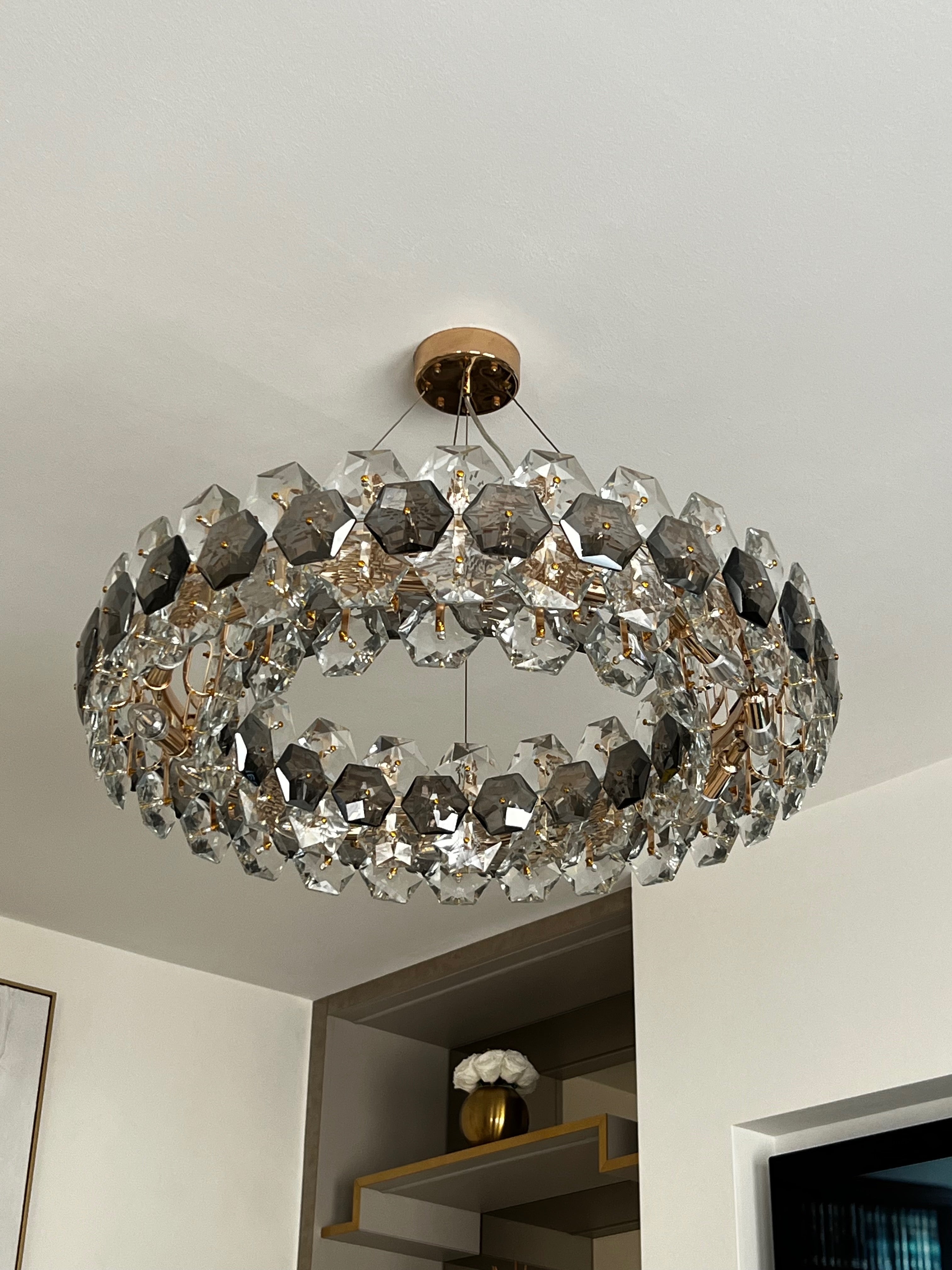 Astoria circular chandelier styled within an elegant luxury interior setting