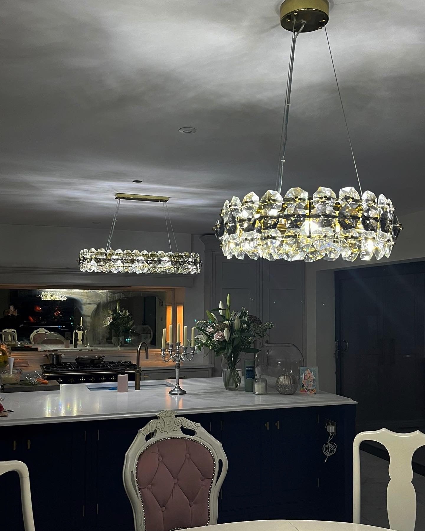 Luxury Astoria circular chandelier showcasing faceted crystals in a refined modern interior