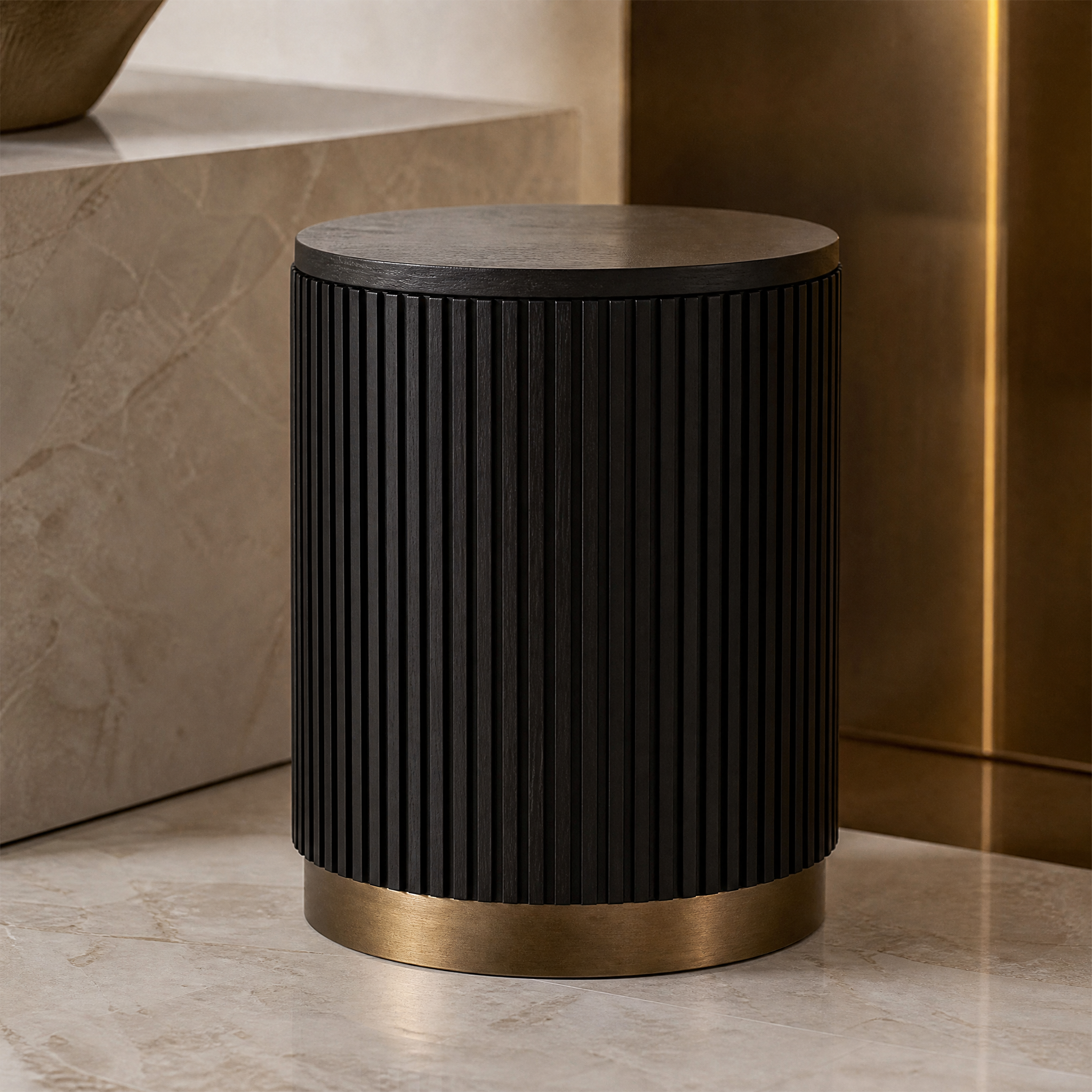 A macro close-up shot focusing on the textured fluted solid oak base and brushed brass plinth of the Attilio side table.