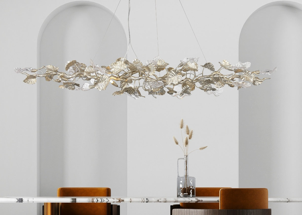 VORELLI® Aura Leaf Rectangular Chandelier styled above a luxury dining table in a refined interior setting