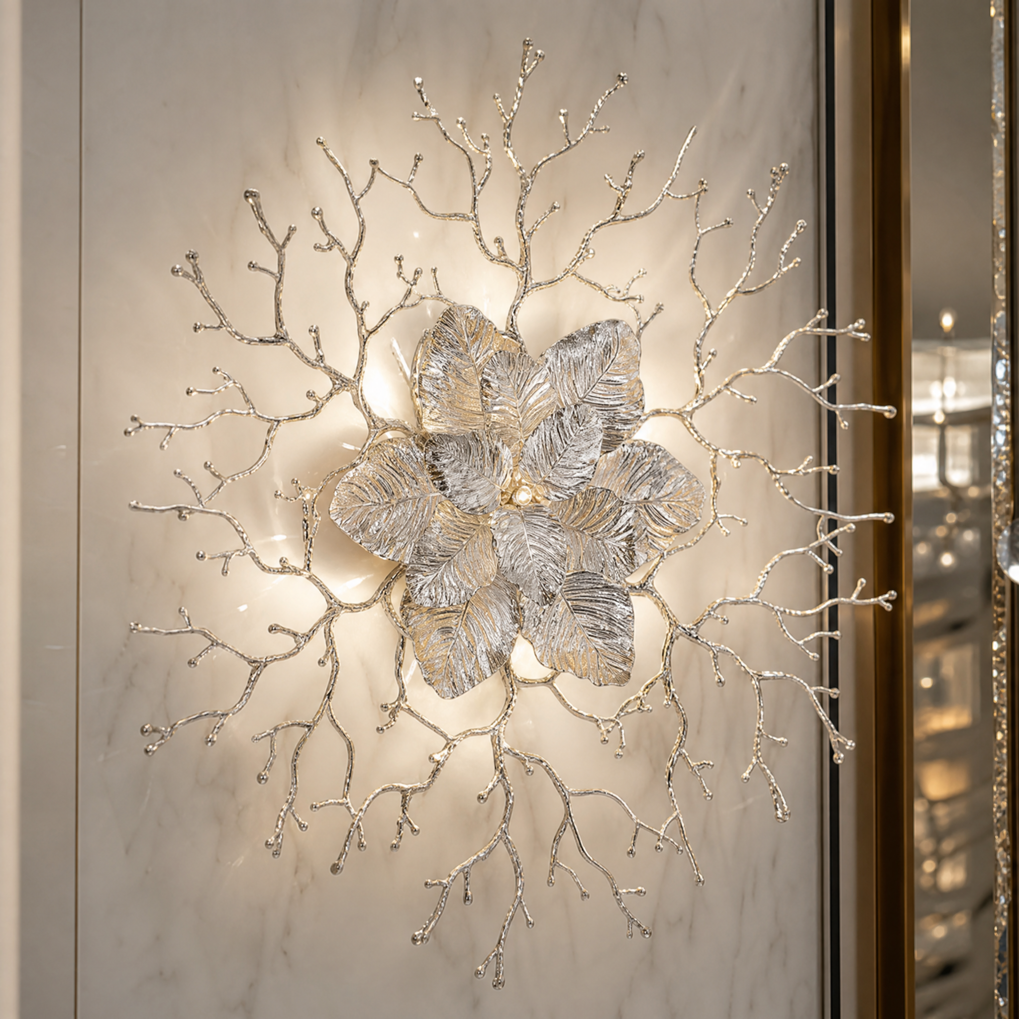 Macro closeup of the VORELLI Aurelia Wall Light II showcasing the intricate texture of its golden leaves and branching organic limbs.