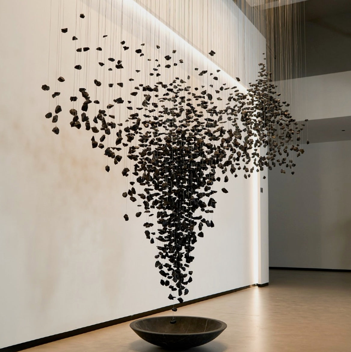 VORELLI Basilica black stone staircase chandelier with sculptural cascading stone design