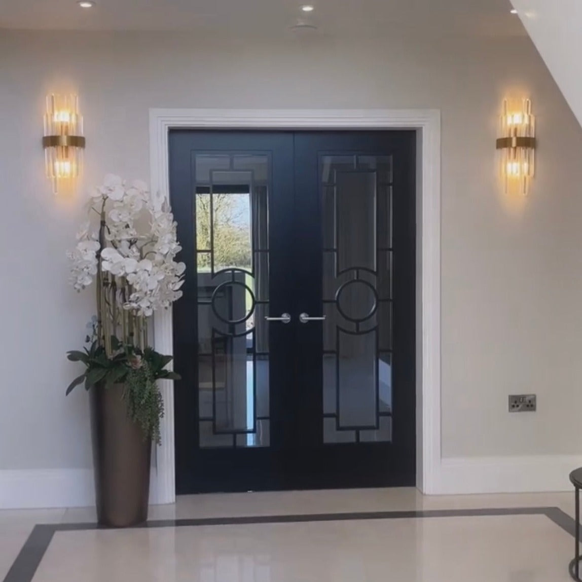 Close-up showcasing gold frame and vertically aligned crystal bars on the Belair wall light.