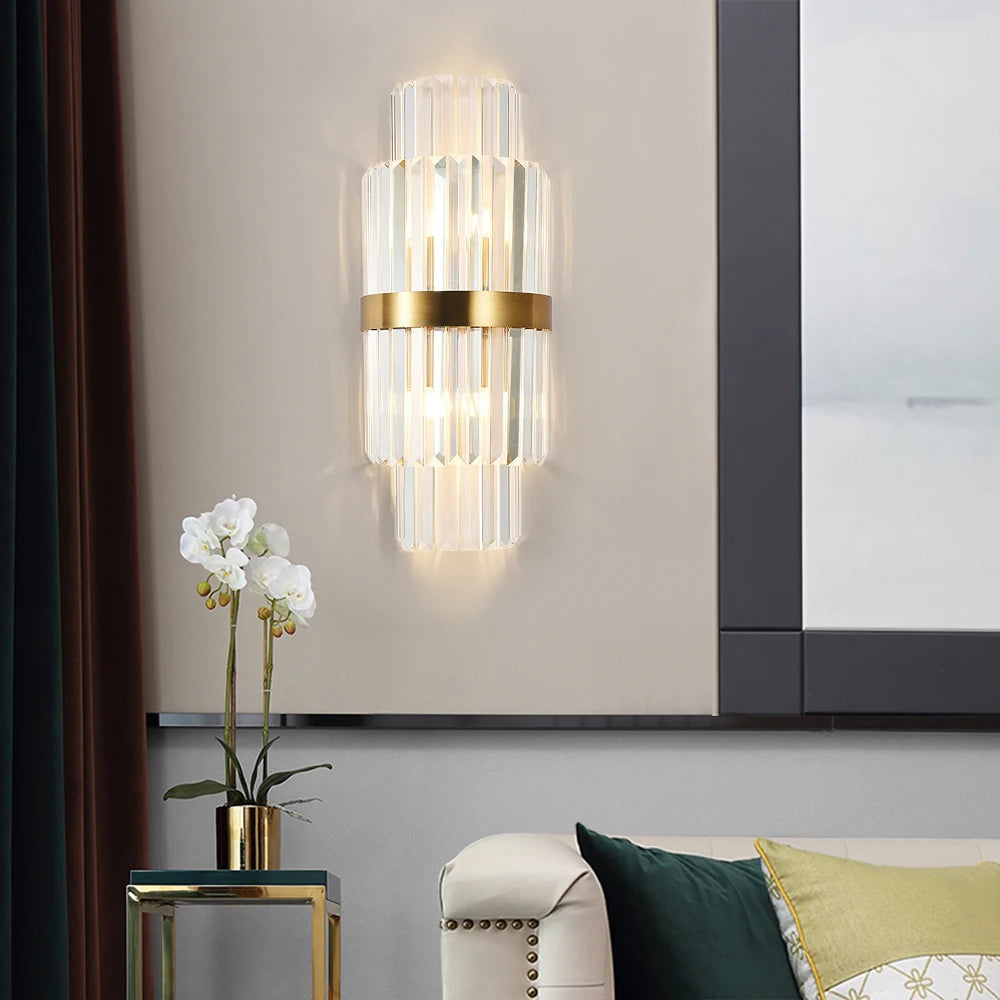 Luxury wall light with crystal bars and gold detailing in a modern interior.