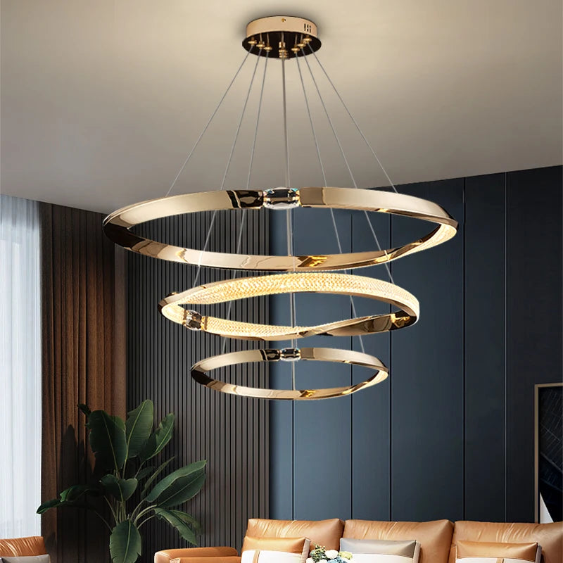 Luxury trio-ring chandelier with diamond cut crystal accents in a modern dining space.