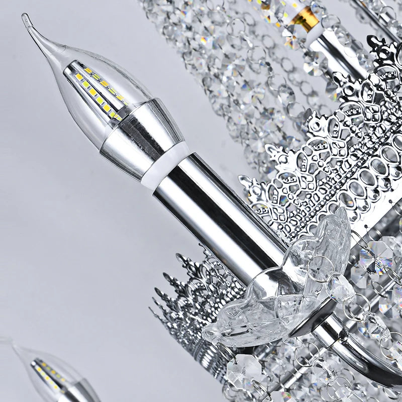 Detailed view of silver crystal rods and reflective components on the chandelier.
