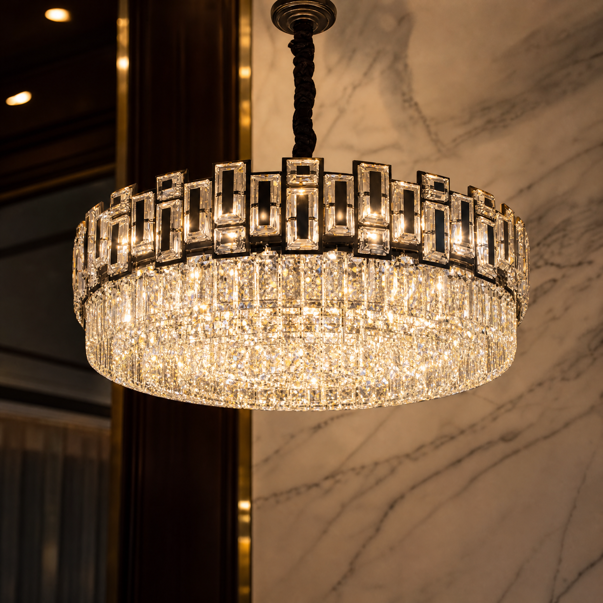 A detailed closeup of the VORELLI Belvedere circular chandelier showcasing the intricate craftsmanship of the rectangle and square crystal frame.