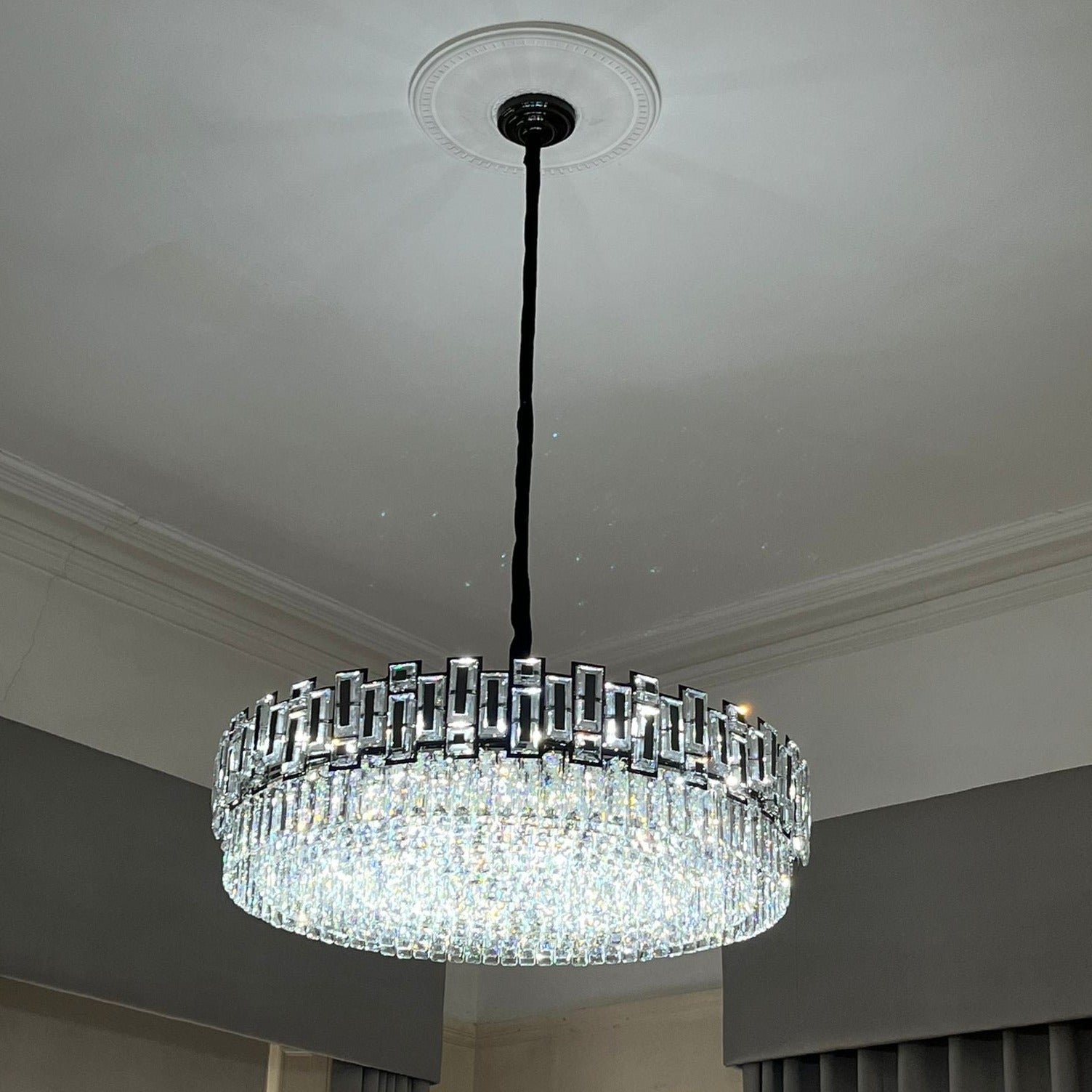Belvedere circular chandelier suspended above a classic interior space.