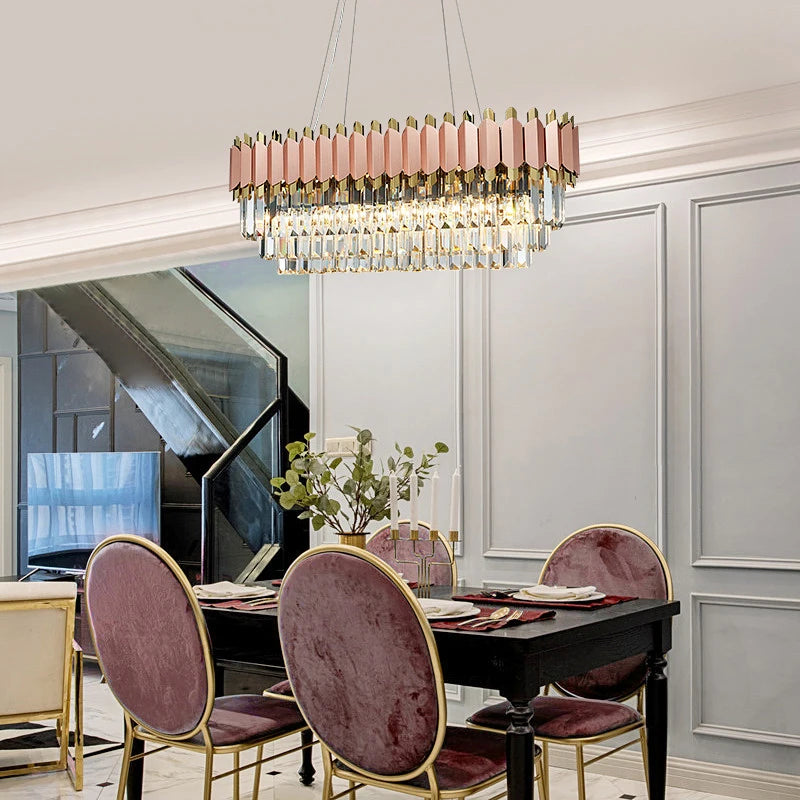 Bianca rectangular chandelier with pink crystal bars suspended above a luxury dining room.