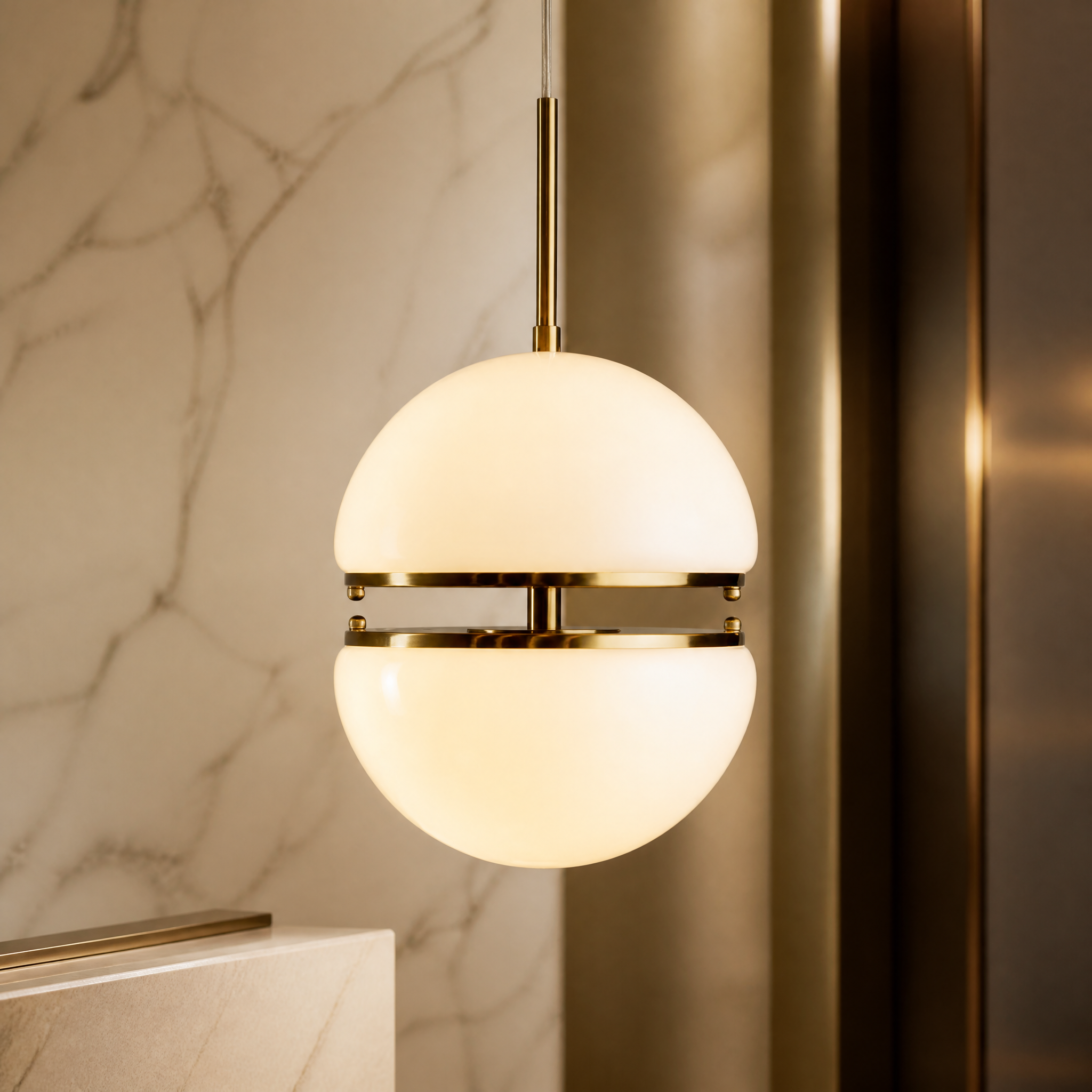 Detailed closeup of the VORELLI Biscaro IP44 pendant light showcasing the split globe opaline glass shade and premium brass hardware craftsmanship.