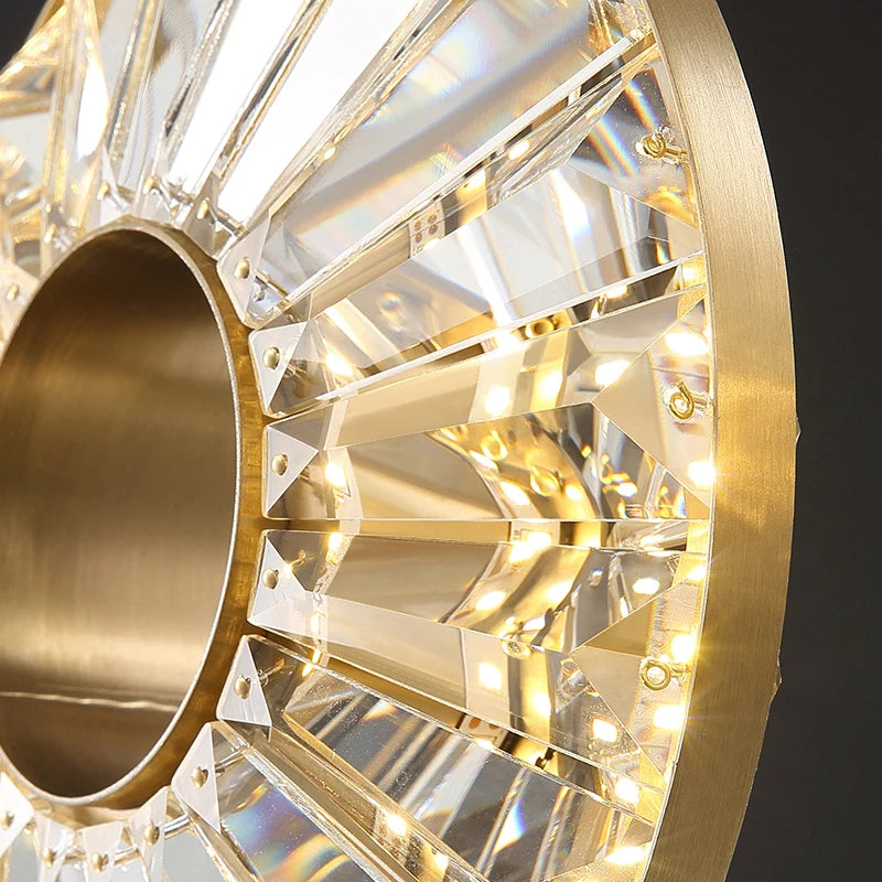 Close-up of Bocelli pendant’s crystal bars and illuminated circular ring design.