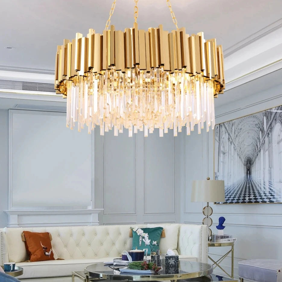 Boeotia circular chandelier featuring gold cuboid tubes and crystal bars in a luxury dining space.
