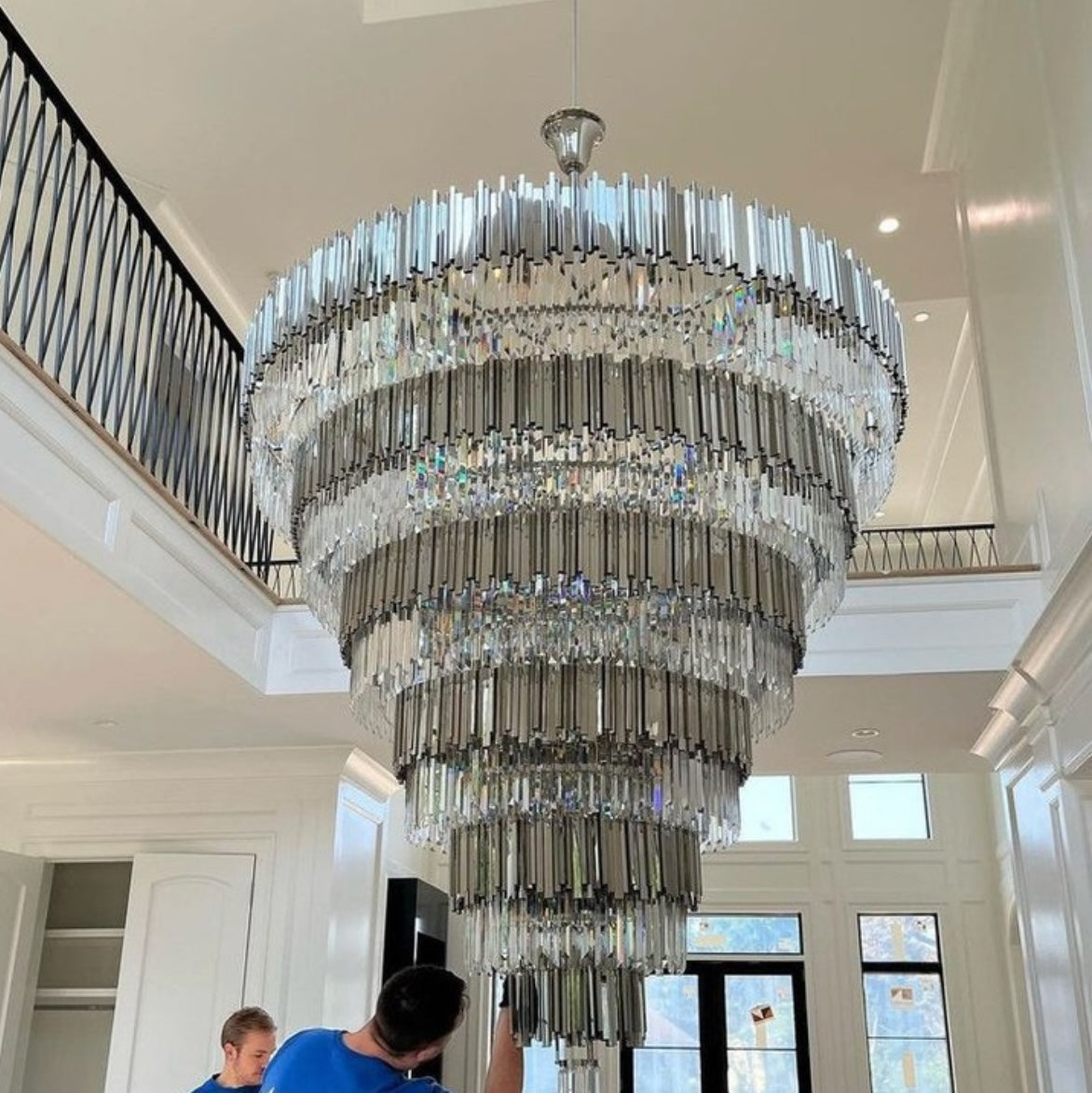 VORELLI® Boeotia Grandeur staircase chandelier with cascading crystal bars in a grand entrance staircase