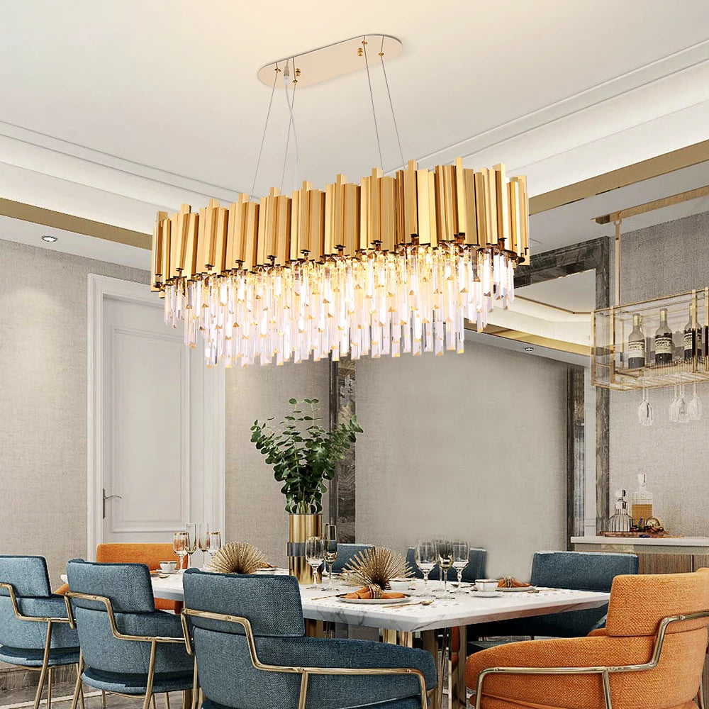Boeotia Rectangular Chandelier with gold cuboid tubing and crystal bars hanging above a luxury dining table.
