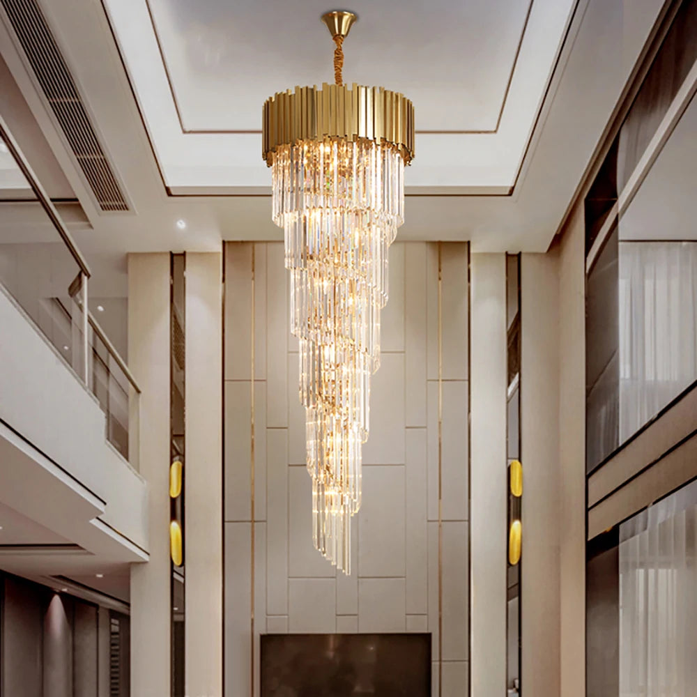 Boeotia Spiral Staircase Chandelier cascading through a grand double-height foyer with gold cuboid tubing and crystal bars.