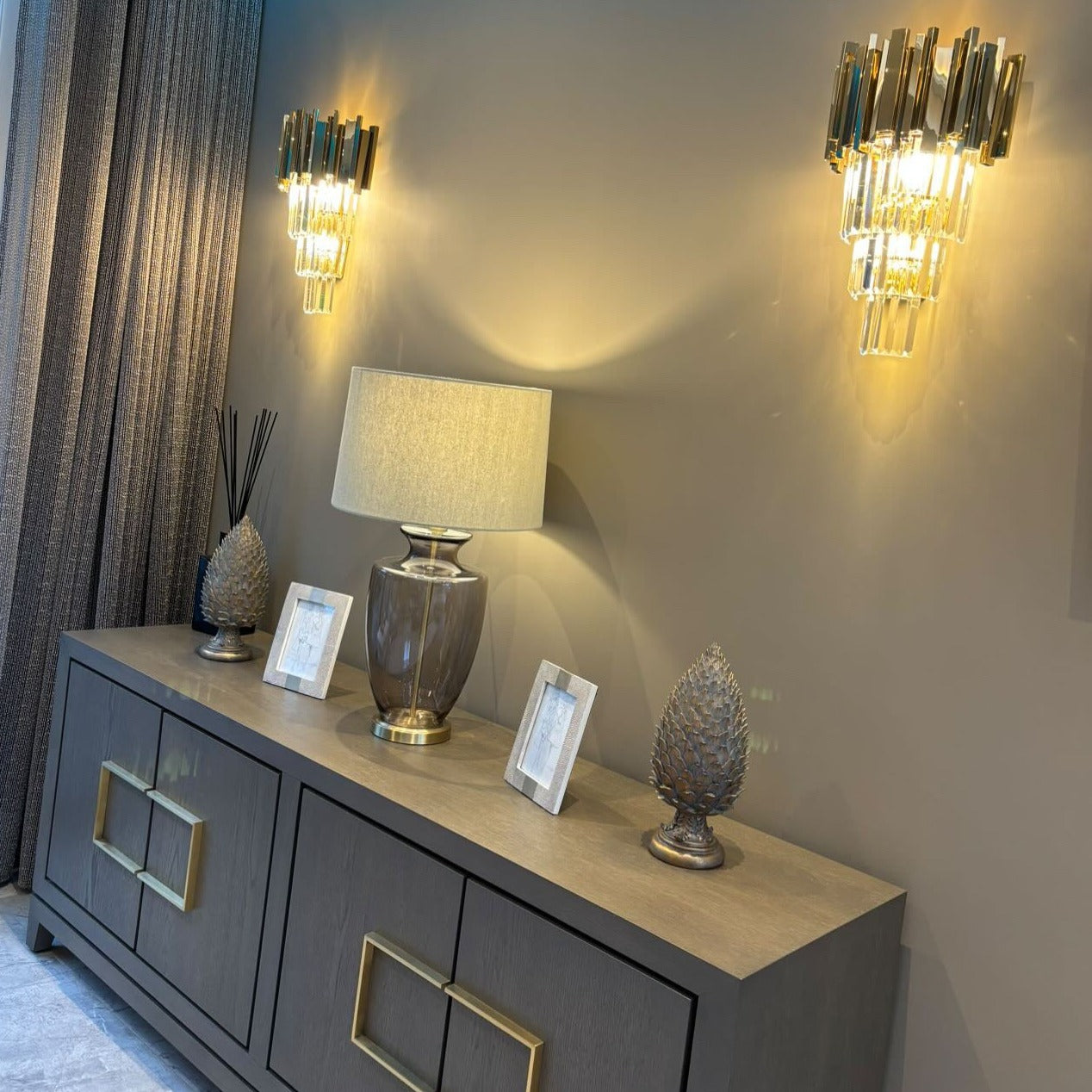 Boeotia Wall Light installed above a sideboard, adding refined illumination to a contemporary interior.