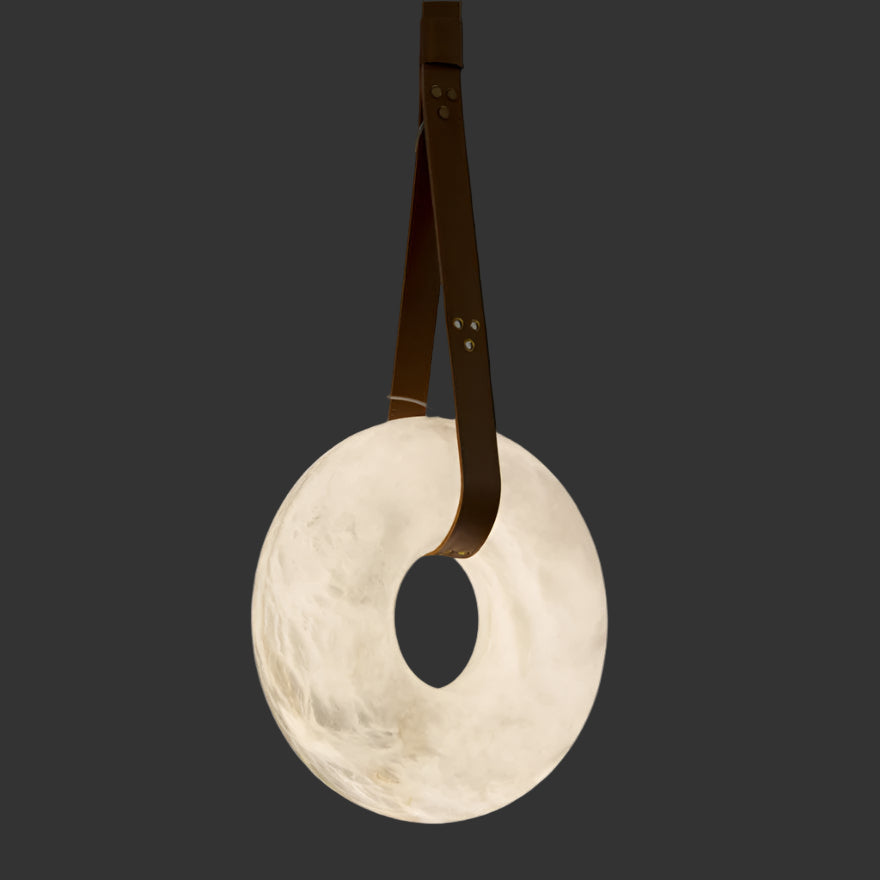 Botticino Marble Pendant Light featuring a sculpted circular marble disc suspended by leather straps.