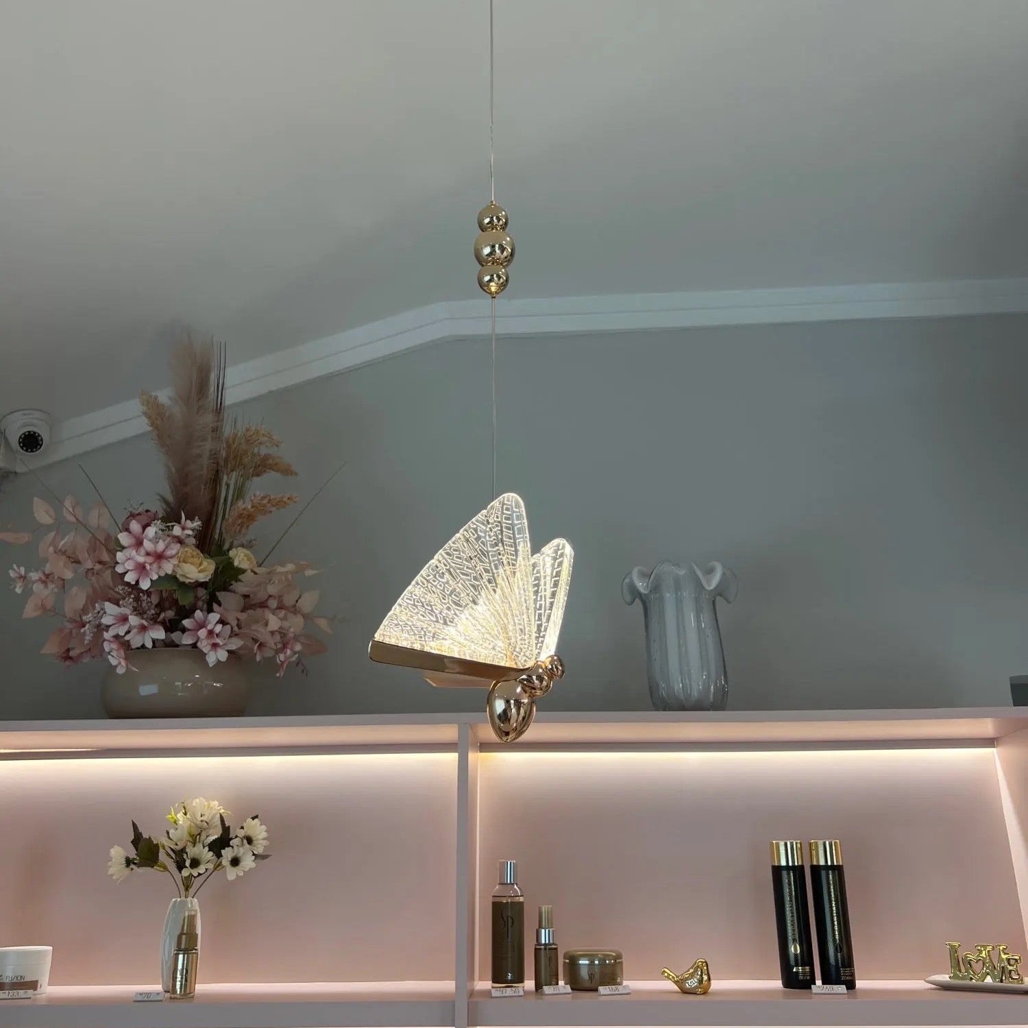 VORELLI butterfly pendant light installation in luxury staircase atrium