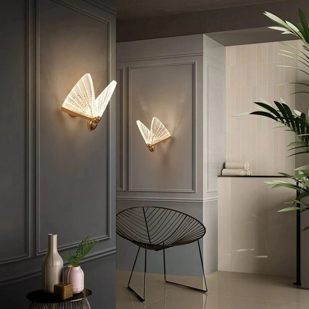 Butterfly Wall Light displayed on a grey wall, highlighting its playful sculptural design and gentle luminosity.