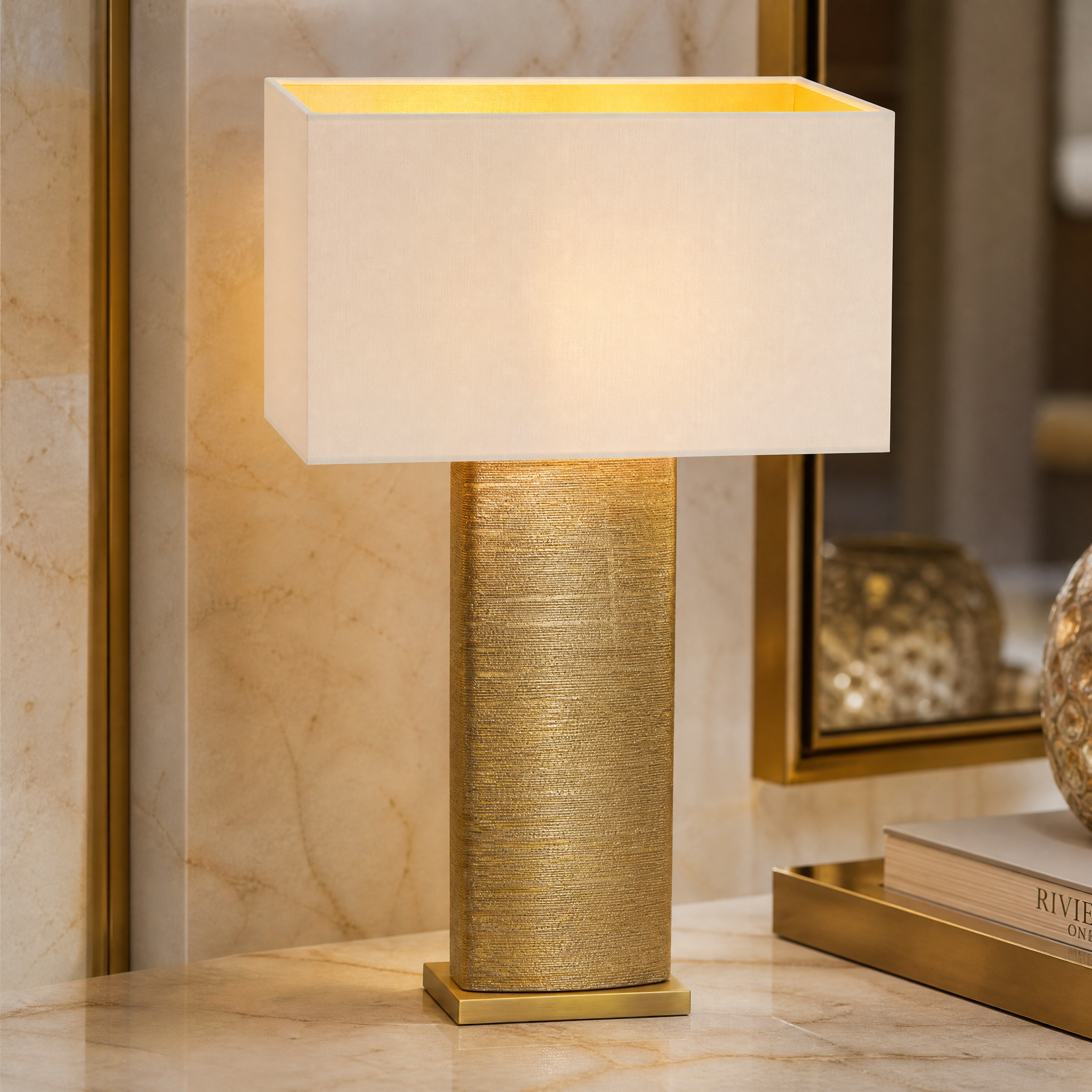Close-up shot of the VORELLI Caelora table lamp highlighting the intricate textured ceramic craftsmanship and sophisticated antique brass detailing.