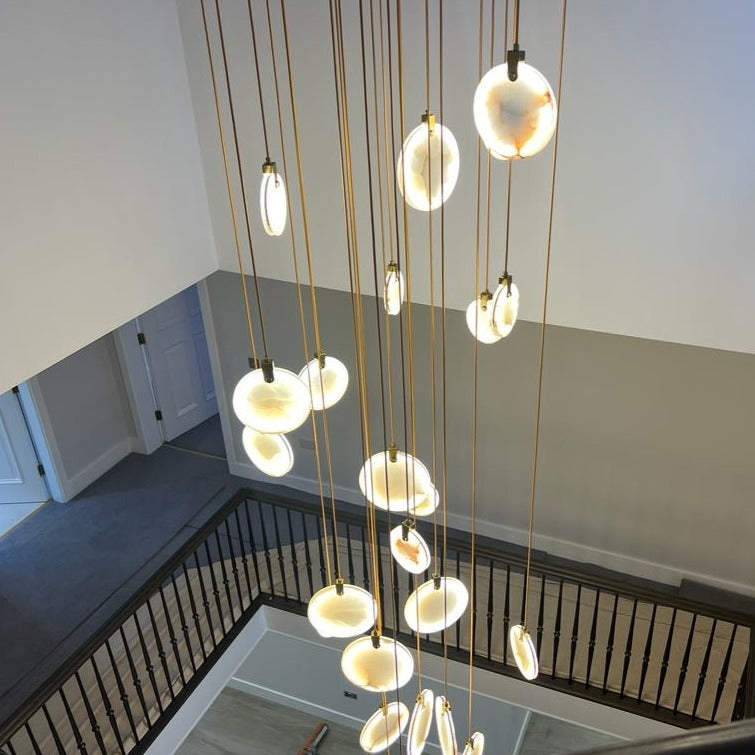 Wide-angle view of the Calacatta Marble Pendant Staircase Chandelier enhancing a contemporary staircase.