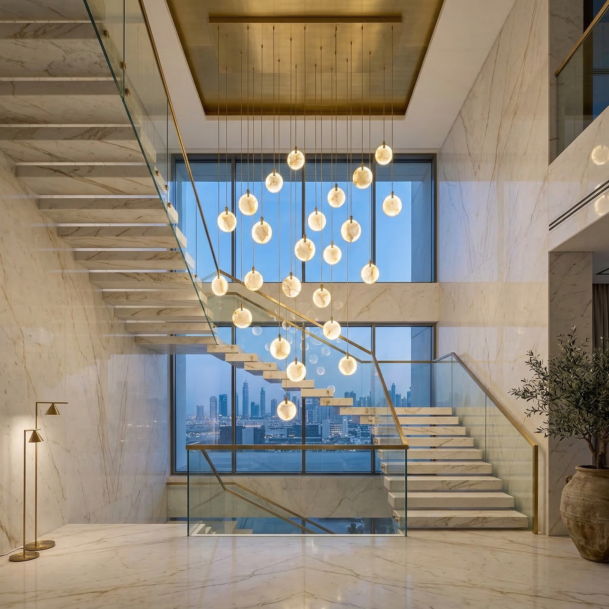 VORELLI® Calacatta marble pendant staircase chandelier in luxury Dubai villa with marble staircase and warm ambient lighting
