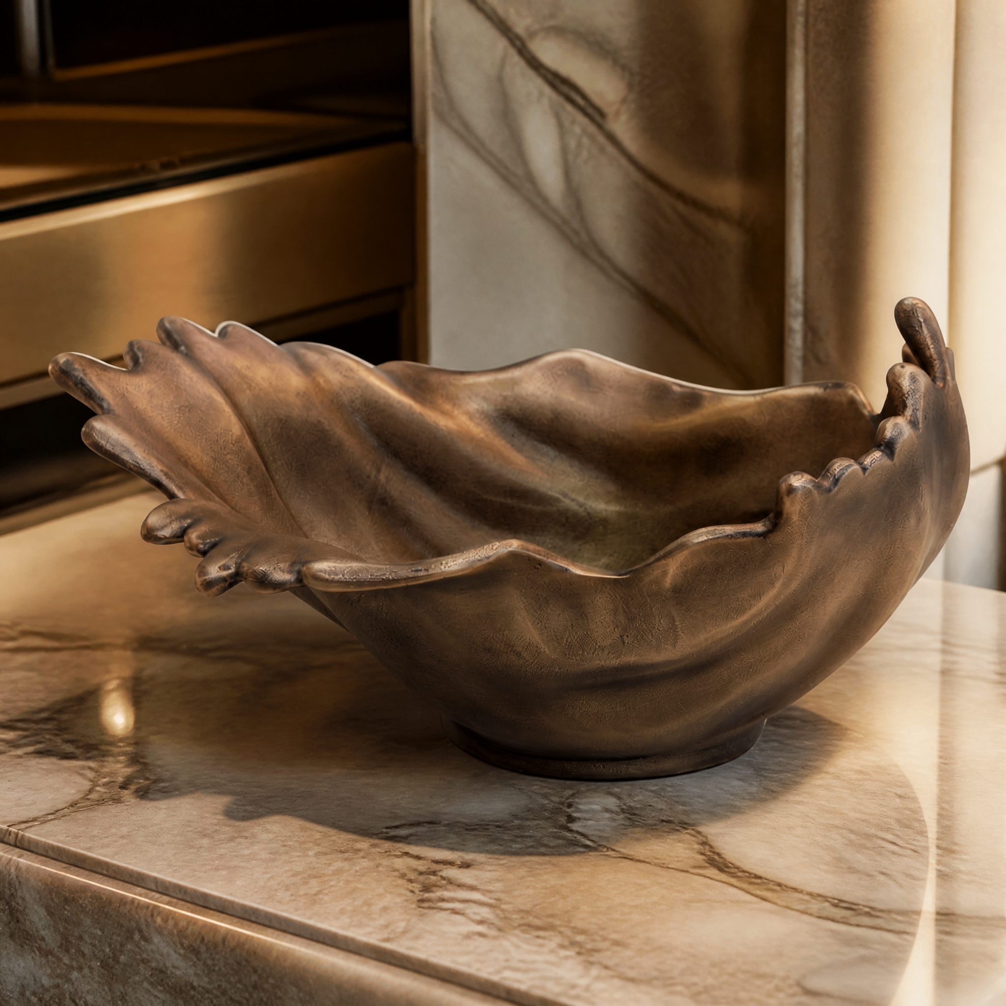 Macro closeup detailing the fine texture and rich metallic finish of the VORELLI Calvino antique gold decorative bowl.