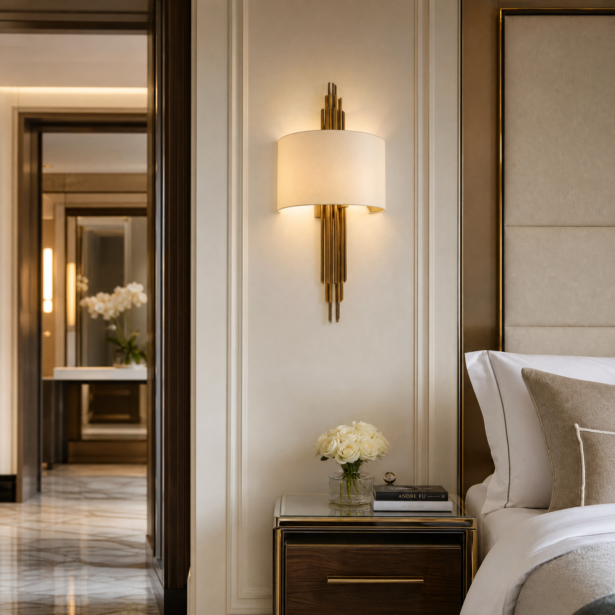 Upscale hotel suite corridor accented by the contemporary silhouette of the VORELLI Castello Wall Light creating a sophisticated hospitality atmosphere.