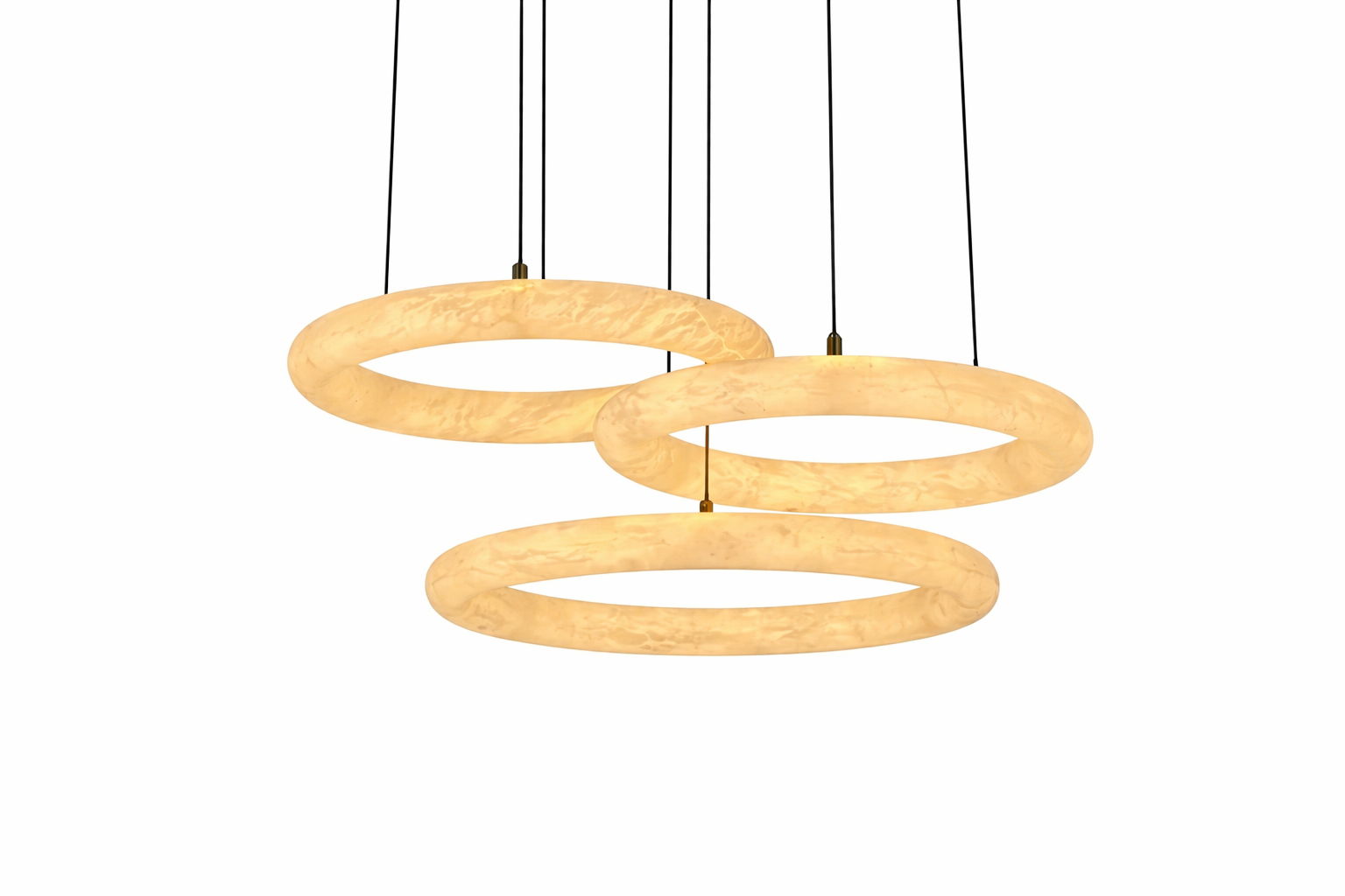 VORELLI Cavani modern trio circular chandelier illuminating a luxury dining room table with an elegant, warm glow.