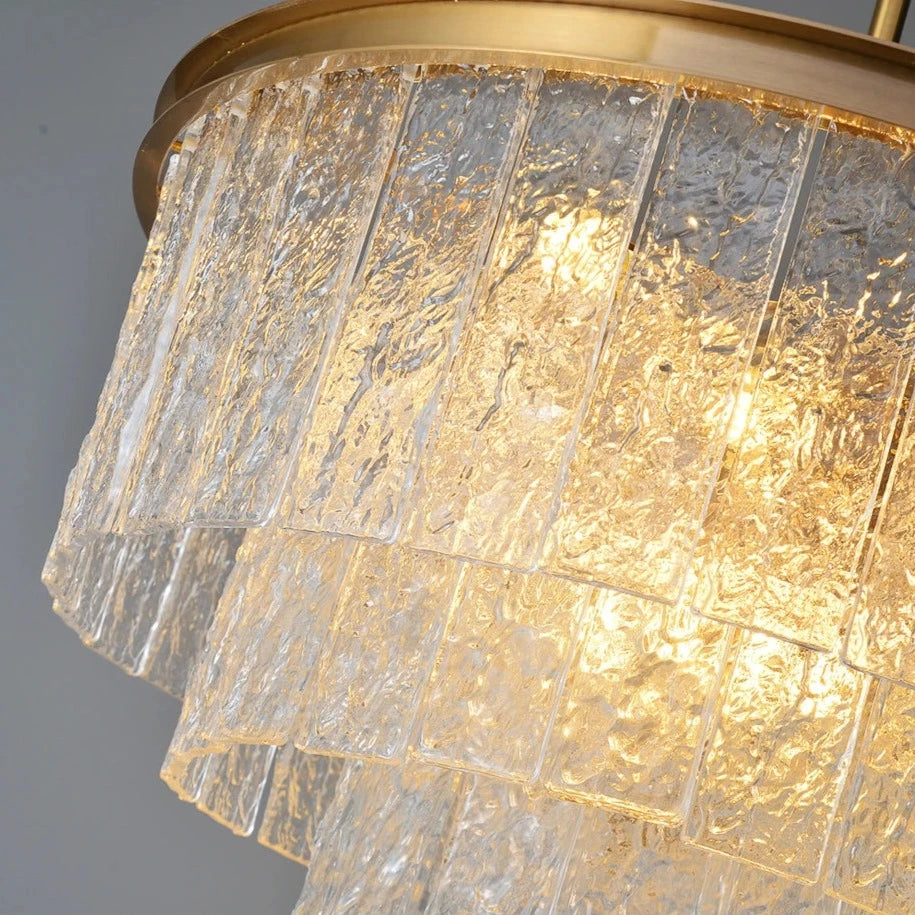 Close-up view of the Cellini Circular Chandelier showcasing cracked textured rectangular crystals and warm illumination